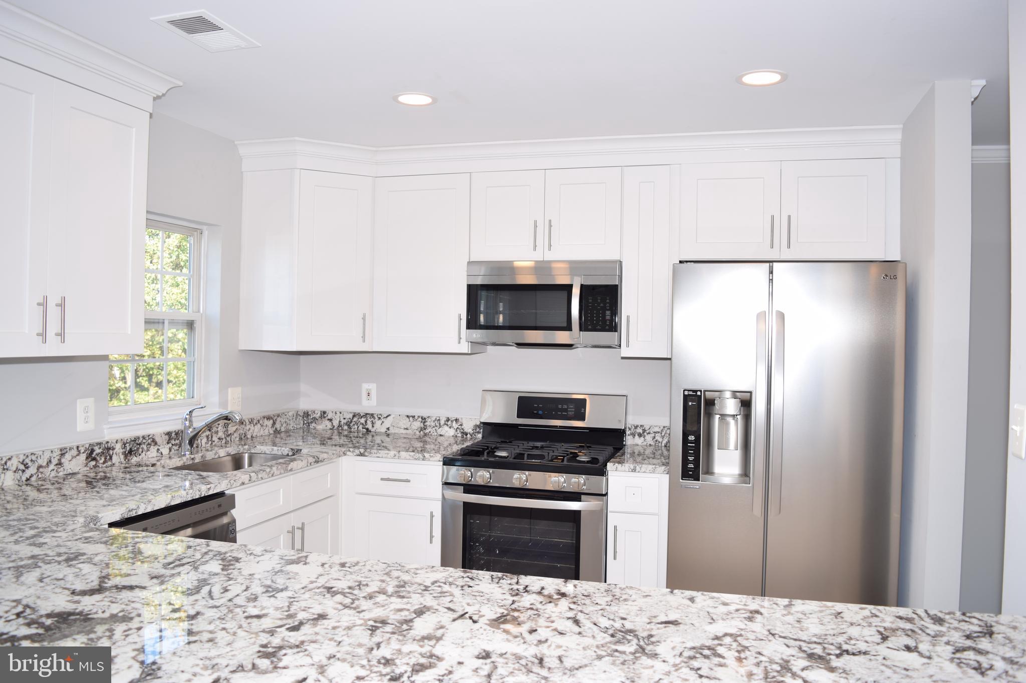 First time rental Tastefully renovated brick front townhome style condo** Brand New kitchen with top of line shaker cabinets and alaska white granite** Brand new stainless steel appliances** Luxury Tiles and new carpet** Modern style fixtures and designer paint** Upgraded baths** 3 bedroom 2 full bath upstairs** Located across from a pocket park** Metro and shopping are just a few minutes walk**Community Shuttle To Metro**Must See