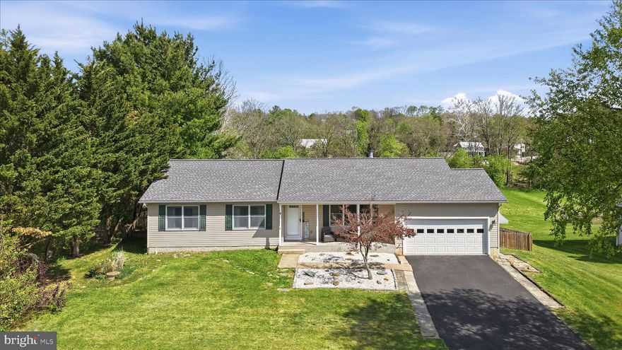 Welcome to 4 Millrace Dr in Keedysville, a beautifully maintained 3-bedroom, 2-bath rancher set on a spacious .85-acre lot. This home offers easy one-level living with a bright layout, featuring a generous living room anchored by a classic stone fireplace, an updated kitchen with quartz countertops, and a dedicated dining area perfect for everyday living and entertaining. Just off the kitchen, you’ll find a convenient main-level laundry room, along with two well-sized secondary bedrooms, a full bath, and a private primary suite. The lower level expands your possibilities with a partially finished basement, drywall already in place, and ready for your finishing touches to create additional living space. You’ll also appreciate the bonus room, abundant storage space, walkout access to the fully fenced backyard (4 years old), and an attached 2-car garage. Step outside to enjoy the newer composite deck (just 3 years old), a storage shed, and peaceful views with property extending to Little Antietam Creek. Recent upgrades include a 2-year-old roof and leased Tesla solar panels ($139/month), keeping electric costs impressively consistent at approximately $6/month year-round. This property delivers the perfect mix of country and suburban living.