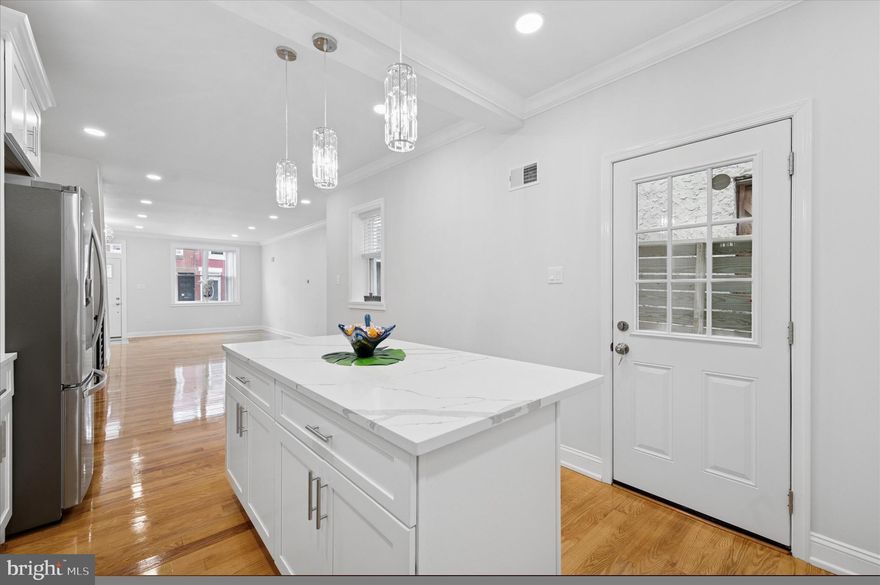 Welcome to 2011 Morris Street , where city living feels grounded, intentional, and refreshingly attainable. On a wide, quiet block in the heart of South Philadelphia, this thoughtfully renovated 4-bedroom, 3-bath home offers more than 1,600 square feet of modern comfort. Designed for real life, where comfort meets connection and everyday moments matter: move-in ready, beautifully finished, and still under $500K.

As you step inside, sunlight spills across rich hardwood floors, highlighting crown molding and an open main level that balances everyday ease with effortless entertaining. This is where mornings start calmly and evenings unfold naturally—whether you’re cooking, hosting, or simply unwinding. The kitchen anchors the space with quartz countertops, classic shaker cabinetry, stainless steel appliances, a generous center island, and timeless tile—equal parts functional and inviting.

Downstairs, the finished basement with a full bath opens up endless possibilities. Guest suite. Home office. Gym. Media room. Play space. The flexibility here means the home can grow and shift with you—without compromise.

Behind the walls, the peace of mind matters just as much as the design. Brand-new systems, plumbing, and electricals, paired with energy-efficient central air, make this a smart, low-stress investment in your future—one that lets you focus on living, not fixing.

Out back, a private rear yard becomes your personal retreat. Morning coffee, summer dinners, container gardening, or a quiet moment at the end of the day—it’s outdoor space that truly gets used.

For first-time buyers, this home is especially compelling. With potential access to Philadelphia homebuyer grants, closing cost assistance, and incentive programs, ownership here may be more achievable than you expect. Why rent when you can own?

And then there’s the lifestyle. A highly walkable setting. Local cafés and neighborhood favorites close by. A bus stop right on the corner. Quick access to Center City, Graduate Hospital, and East Passyunk. This is city living with rhythm and charm—connected, convenient, and comfortable.

This is not just a home—it’s a smart investment, a fresh start, and a lifestyle you’ll love coming home to.