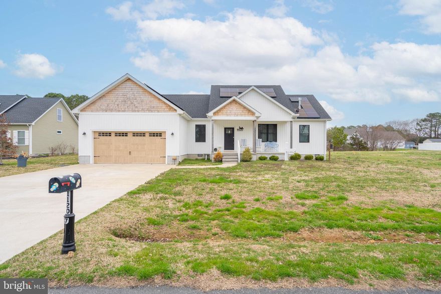 Tucked inside the beautiful waterfront community of Holiday Harbor in Bishopville, this custom-built Craftsman home offers that rare blend of refined coastal elegance and comfortable, everyday living. Built in 2021, this thoughtfully designed one-level home features 3 bedrooms, 2 full baths, and an open, airy layout that feels both welcoming and elevated. Vaulted ceilings create a sense of space and light, while the gas fireplace adds warmth and character to the heart of the home. The kitchen was designed to gather in — complete with granite countertops, stainless steel appliances, upgraded cabinetry, and seamless flow into the main living area, making it ideal for entertaining or simply enjoying a quiet evening in. The primary suite is privately positioned and feels like a retreat, offering generous space, a walk-in closet, and a beautifully appointed bath. Two additional bedrooms provide flexibility for guests, a home office, or hobbies. Situated on nearly half an acre with peaceful creek views behind the home, the setting offers privacy and a true connection to nature — something that’s increasingly hard to find. An attached two-car garage and concrete driveway add convenience, while the location places you just minutes from Lighthouse Sound Golf Course and the beaches of Ocean City and Delaware, giving you access to boating, golf, dining, and coastal living at its best.