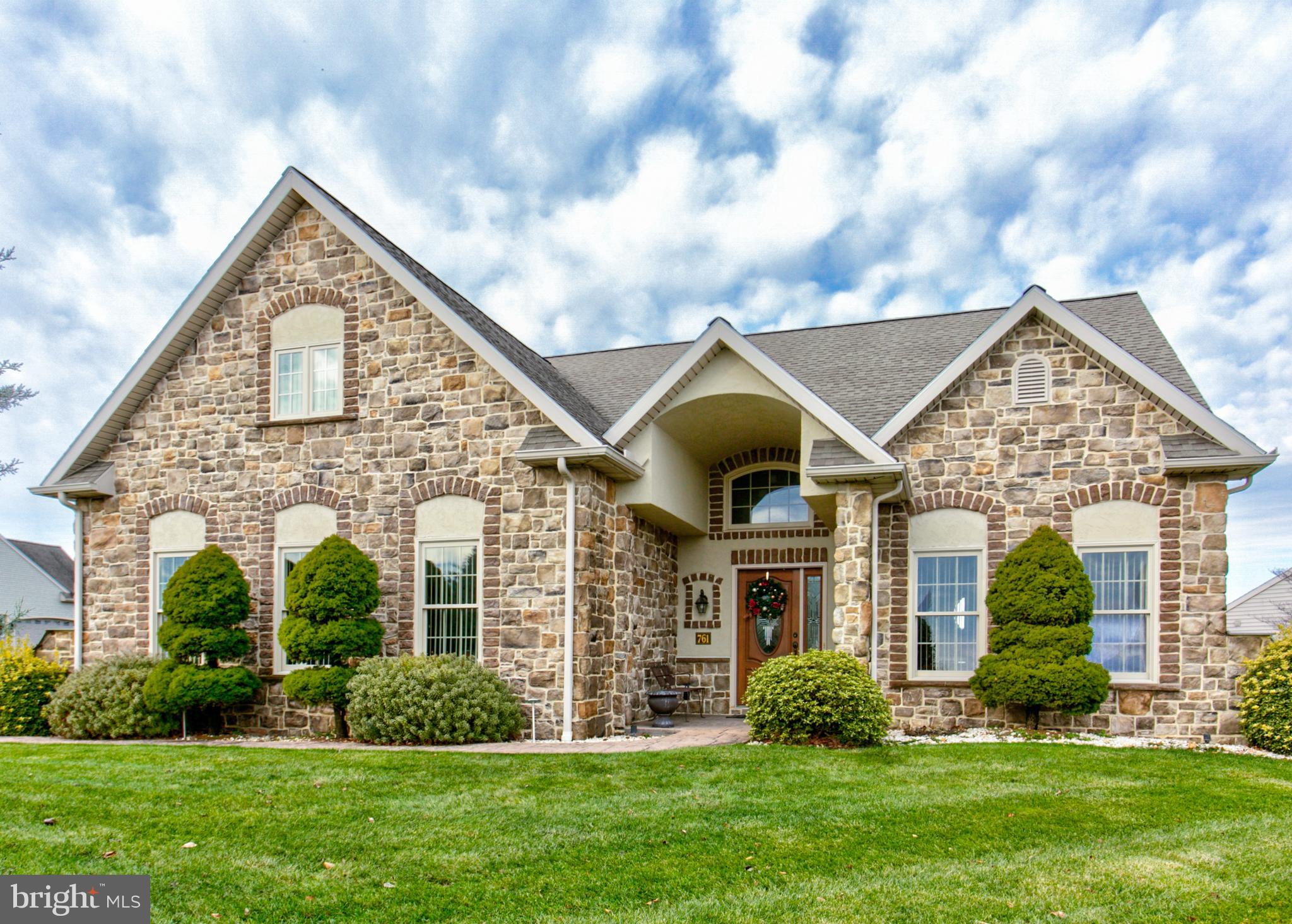 Beautiful custom home in Brookshire's 55+ community in Manheim. Large entry with cathedral ceilings, custom stone walls, double sided fireplace in the living room and large custom archways is just a few of the custom features in this home. 4 Bedrooms, 2.5 Baths with master suite on the first floor. In addition to the first floor master, you will also enjoy the spacious living room, 4 seasons room, and office. Upstairs will allow for your visiting guests or family to have their own space to rest and relax. Enjoy the convenience of central vac, natural gas heat and a large stamped concrete patio with stonework archways. Lots of storage throughout and Large 2 car garage and storage shed.
