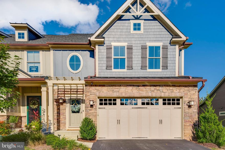 A rare opportunity to own a like-new home tucked away in the 55+ community of Stoneleigh Summit! Upon arrival you will notice the stunning curb appeal from the unique villa architecture to beautiful stonework around the two car garage. Follow the gleaming hardwood floors from the entrance all the way through the main level. Cooking will be a delight in the gourmet kitchen with stainless steel appliances, modern cabinetry, double ovens, and granite countertops. Friends and family can pull up a chair to the charming breakfast bar or enjoy conversation in the spacious dining area. Light abounds in this home between large windows, plenty of recessed lighting, and under cabinet lighting in the kitchen. The soaring cathedral ceiling in the living room makes this a beautiful grandiose space to entertain or relax. The primary bedroom and modern spacious primary bathroom are conveniently located on the main level. The cherry on top of this space is the option to walk outside to your magnificent combination screened in porch and outdoor deck space. Enjoy a book without pesky bugs on your tranquil and private screened in porch that overlooks the lush greenery at the Country Club of Maryland. Upstairs you will find three light filled bedrooms, an additional full bathroom, and a spacious bonus loft area overlooking the living room with additional recessed lighting. The light filled walkout lower level features a wet bar with an island, built-in wine refrigerator and an additional family room space. Enjoy chilly evenings in front of the picturesque gas fireplace with beautiful stonework. Don't miss out on the opportunity to own the first home on the market in the Stoneleigh Summit community!