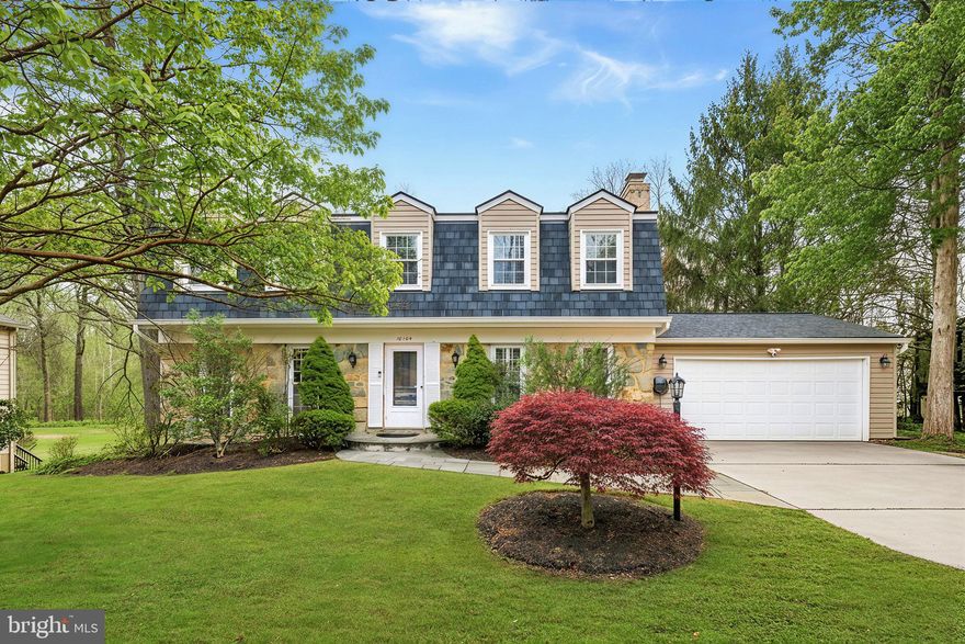 *Driveway to be repaved when weather permits* Experience 10104 Colebrook Avenue, a classic center-hall Colonial on a .25-acre lot in the sought-after Bedfordshire community of Potomac. This picturesque stone-front home offers 3,468 square feet of living space across three finished levels, featuring 5 bedrooms, 3 full bathrooms, a powder room, and a finished garage/bonus room that contributes to the total square footage.
Meticulously maintained, the home includes extensive updates: a NEW CertainTeed architectural shingle roof (2023), replacement of original windows, top-of-the-line bidets in all bathrooms, a kitchen renovation (2017), NEW lower-level ducting (2023), a renovated lower level with leveled-and-glued engineered wood floors (2023), a newer porcelain tile patio, and a NEW LG washer/dryer.
Step inside to bright, welcoming spaces highlighted by gleaming hardwood floors on both upper levels, ornate crown molding, and recessed lighting. The updated kitchen features granite countertops, stainless steel appliances, soft-close cabinetry, table space, and a breakfast-bar peninsula. The adjoining family room offers a cozy wood-burning fireplace (unused by the current owners), set in a painted brick surround. The formal living and dining rooms flow seamlessly, and the dining room’s French doors open to a walk-down deck overlooking a spacious backyard. A powder room and laundry/mud room complete the main level.
A rare bonus: the spacious 2-car garage has been finished to provide exceptional additional main-level living space—ideal as a home gym, yoga studio, workshop, or flex room. It features floor-to-ceiling insulation (including the garage door), porcelain tile flooring, a dual-inverter HVAC unit with heat, 20-amp outlets, 360-degree ethernet, and a Stage 2 EV charger.
Upstairs, oak hardwoods continue throughout, enhancing the home’s cohesive feel. The spacious owner’s suite includes a sitting area, a walk-in closet with built-in shelving, and an en-suite bath with a glass-door shower, dual vanity, and Toto toilet. Three additional bedrooms and a full hall bath complete the upper level.
The fully finished walk-out lower level offers resilient engineered wood floors, a generous recreation room, a fifth bedroom, an updated full bath, and a utility room with ample storage. The rec room opens to an inviting sunroom featuring walls of windows, skylights, cathedral ceilings, and a ceiling fan, with multiple access points to the backyard and the side patio finished in porcelain tile.
Outside, enjoy a tranquil retreat with a large, level backyard, walk-down deck, rear patio, side porcelain-tile patio, and sunroom—perfect for relaxing or entertaining.
Ideally located with easy access to dining, shopping, entertainment, and major commuter routes—plus nearby parks, recreation, and nationally rated golf courses. Top-rated Montgomery County schools further enhance the appeal.
Don’t miss this exceptional opportunity to own in one of the DC area’s most sought-after communities!