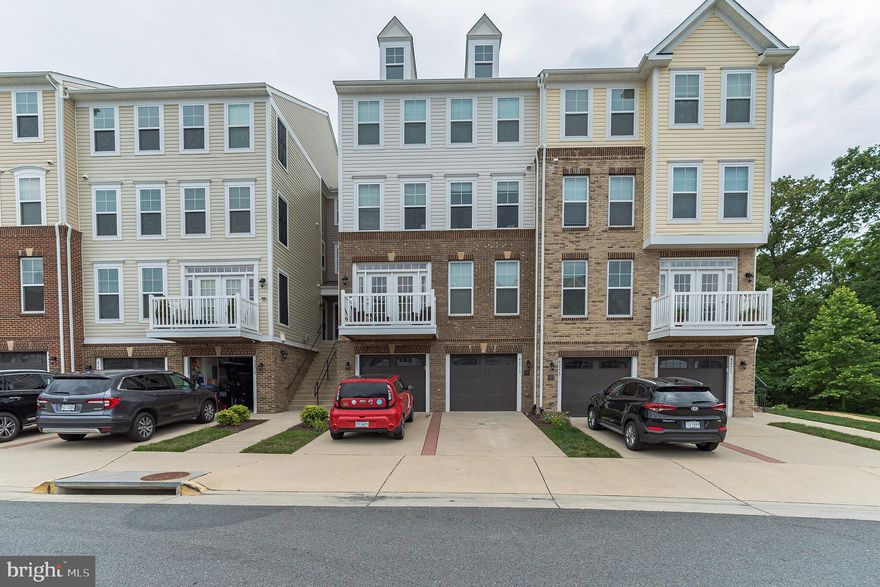 Best location in the community - backs to trees and oh so private!You will LOVE this 4-level townhome-style condo. The engineered hardwoods are  gorgeous , the kitchen has nearly new SS appliances, granite countertops,  and a cool tin backsplash.  The lower level has a bar with mini-fridge, large family room with sliders to the rear yard area, and half bath.  Plus an over-sized 1 car garage with insulated garage door.The floor plan is fantastic - with 4 levels there is plenty of privacy, yet the living spaces are good sized.  And who doesn't love the master bedroom up on it's own level - it's a beautiful space with a super nice master bath with plantation shutters, soaking tub and separate shower. Note the Carrier Infinity system HVAC, sump pump, premium Ben Moore paint throughout, large laundry room on upper level - there are so many extras that make this place a fantastic value. And convenience at every turn - walk to the library, shopping, restaurants and pool.  But the rear deck with  trees all around is my favorite spot.  It's not your everyday condo, folks - you can enjoy a little bit of nature each morning from the quietness of your own wooded sanctuary! This place is truly beautiful. And presented perfectly. Can't wait for you to visit!