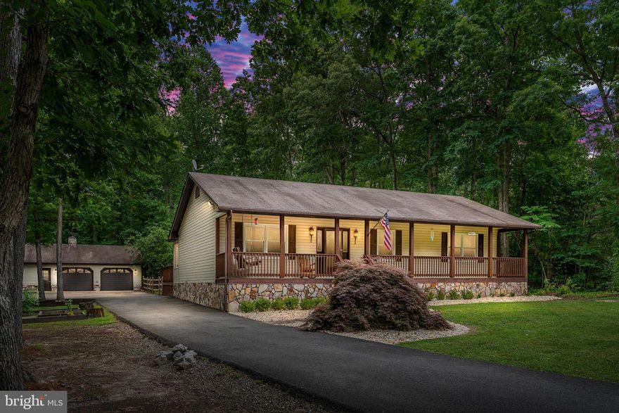 Welcome Home!  Sitting on 1.18 acres, in a lovely gated community with a host of accessible amenities, this 3 bedroom/ 2 full bath rambler's natural character stands out with its stone detail, well-manicured landscape and warm front porch.  Its contemporary open floor layout boasts beautiful updated flooring, fresh paint and brand-new windows throughout!  The master bedroom is furnished with a walk-in closet and full bathroom!   All bathrooms are adorned with custom lighting and updated fixtures.  The eat-in kitchen, which opens to the living room, dining area and sunroom, features stainless steel appliances, white cabinets and a peninsula counter for additional storage and casual seating.  From the updated eat-in kitchen, walk directly into a spacious sunroom (bonus room), which can be used as a recreation room, 2nd family room, dining room, office space, etc. and features modern wide plank flooring with impressive oversized windows to allow for wonderful natural lighting!  The sunroom leads you to a grand outside deck that overlooks a fenced-in tree lined backyard. This home offers outdoor living at its best!  The outdoor space features 1.18 acres and favors a park like setting that is a wonderfully unique character to the house and the neighborhood.   But wait, there's more!  This home features a double entry paved driveway which guides you to a detached 2-car garage!   The detached 2-car garage boasts plenty of space and includes a side room/office area and upper attic space for additional storage!  This home is Turnkey Ready!   Do not miss out!