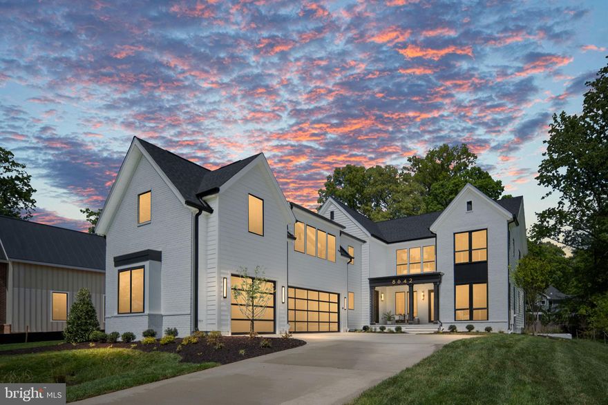 Open House This Sunday, May 3rd, 2-4 PM! Capital Custom Homes proudly introduces 8642 McHenry Street, an extraordinary modern transitional residence set on a rare ½-acre homesite on one of Vienna’s most quaint and sought-after streets, complete with a highly coveted 3-car courtyard garage, full in-law/au pair suite,and back kitchen/pantry. Expertly crafted by Capital Custom Homes, this exceptional new construction offers over 7,300 gross square feet of meticulously designed luxury home, blending architectural sophistication with thoughtful functionality for today’s multigenerational lifestyle. Positioned on a quiet, established street known for its charm and sense of community, this home delivers the privacy, scale, and presence luxury buyers expect—just minutes from downtown Vienna. Our expansive Brooks floor plan features 7 bedrooms, 6 full baths, and 2 half baths, with soaring 10-foot ceilings on the main level and 9-foot ceilings above and below. Wide-plank white oak hardwood flooring flows throughout all three levels, creating a refined yet inviting aesthetic. Designed for elevated entertaining and seamless daily living, the kitchen is anchored by a chef’s Wolf/Sub Zero appliance suite, the gold standard in luxury performance. Highlights include a Wolf 48” Professional gas range, 48” built-in Sub-Zero refrigerator, Cove dishwasher, all complemented by full-overlay custom cabinetry stacked to the ceiling and heavy-profile quartz kitchen and island countertops that create substantial visual impact. A thoughtfully designed back kitchen/pantry and separate large servery with beverage center enhance entertaining flow while maintaining a pristine main space. A private main-level en-suite bedroom offers ideal flexibility as a guest suite or executive office. Upstairs, a thoughtfully designed in-law/au pair suite, separately accessible with back staircase or future elevator, provides rare independence and privacy—an exceptional feature for extended family or live-in support. The owner’s retreat serves as a true sanctuary, featuring hardwood flooring, dual quartz vanities, a soaking tub, and an oversized spa shower with rain and dual showerheads. Elevated Lower-Level Entertaining. The finished lower level is designed as a true extension of the home’s luxury lifestyle. The spacious recreation room features custom-built-ins and a dramatic floor-to-ceiling tiled fireplace, creating a striking focal point and refined gathering space. A thoughtfully designed wet bar enhances entertaining, making the lower level ideal for hosting guests or relaxing evenings at home. This level also includes a dedicated media room, exercise room with rubber flooring, full bath, powder room, and a generous seventh bedroom. An elevator-ready shaft provides future multi-level accessibility. Exceptional Outdoor Living Designed to maximize the beauty and scale of the ½-acre lot, the outdoor living spaces are equally impressive. An expansive screened porch functions as a three-season retreat, anchored by a stunning white brick 42” gas fireplace with wrought iron horizontal rails and a cathedral ceiling.  The porch flows seamlessly to an adjoining outdoor deck, offering generous space for dining, lounging, and entertaining while overlooking professionally landscaped grounds. This stunning backyard has ample space for a future pool or even a putting green! Exterior appointments include a rich brick façade, James Hardie Plank siding, architectural shingles, and a substantial slate front porch, steps, and walkway that reinforce the home’s timeless presence. Ideally located with convenient access to downtown Vienna, the shops and dining at Mosaic District and Tysons Corner Center, the Vienna/Fairfax–GMU Metro Station, and major commuter routes including I-66, Route 50,and Route 123. Photos and tour are of another model and may include optional upgrades. Contact the listing agent for pricing, specifications,and available customizations.