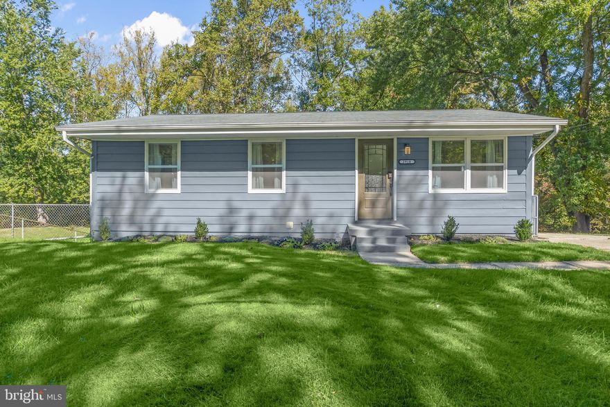 Nestled in the desirable Rosedale Estates community, this beautifully renovated ranch-style home offers nearly 2,000 square feet of thoughtfully designed living space. Blending style and functionality, it features four spacious bedrooms and four tastefully updated bathrooms, creating a setting that’s equally suited for everyday living and entertaining. An open floor plan connects the living, dining, and kitchen areas, allowing gatherings to flow easily from one space to the next. The kitchen sits at the heart of the home, showcasing gleaming quartz countertops, stainless steel appliances, a gas range, and a tile backsplash that frames the windows overlooking the backyard. Convenient side-door access from the driveway makes daily routines effortless. Crown molding and recessed lighting elevate the combined living and dining area, while rich hardwood floors extend throughout the main level, adding warmth and continuity. The main level also hosts the primary bedroom with an en-suite bath, along with two additional bedrooms that share a well-appointed full bath, each space designed with comfort and practicality in mind. The fully finished basement expands your living space with a walkout entrance, ideal for a home office, guest suite, or play area. Two full baths on this level include an en-suite for the fourth bedroom, ensuring comfort and privacy for everyone. All bathrooms feature stylish tile and modern finishes that complement the home’s cohesive design. Modern security features add peace of mind, while the 0.31-acre lot provides a beautiful outdoor retreat. Mature trees offer privacy and a natural backdrop for summer barbecues, quiet mornings, or evenings spent under the stars. A concrete driveway provides ample parking, completing the home’s convenience and appeal. Located on Lumar Drive in Fort Washington, this residence offers the perfect blend of suburban tranquility and accessibility. Just minutes away, the National Harbor area provides endless entertainment, shopping, and dining options, from Tanger Outlets to the MGM Casino. Commuters will appreciate easy access to major routes including I-495 and Route 210, as well as the  Fort Washington Metro station, offering a direct connection to downtown Washington, D.C. With every detail thoughtfully considered, this Rosedale Estates home offers comfort, charm, and modern convenience in a setting you’ll be proud to call your own.