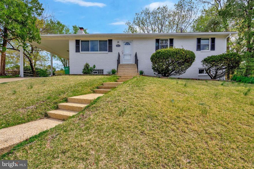 Welcome to this beautifully updated home offering 4 bedrooms and 3 full baths, complete with a convenient carport. The main level features fresh paint, brand new LVP flooring, and a spacious layout with 3 bedrooms and 2 fully renovated bathrooms. Enjoy cooking in the stunning kitchen adorned with granite countertops, a stylish backsplash, and all-new stainless steel appliances. A large family room and ceiling fans throughout add comfort and charm. The fully finished lower level offers additional living space with a cozy wood-burning fireplace, a fourth bedroom, a third full bath, fresh paint, and new LVP flooring—perfect for guests or extended family. Located in a highly convenient area, this home is just a short drive from major commuting routes, making travel to Washington, D.C., and other metropolitan areas quick and easy. It’s also in close proximity to Andrews Air Force Base and other key military installations in the DMV area. Move-in ready and filled with updates, this home is a must-see!