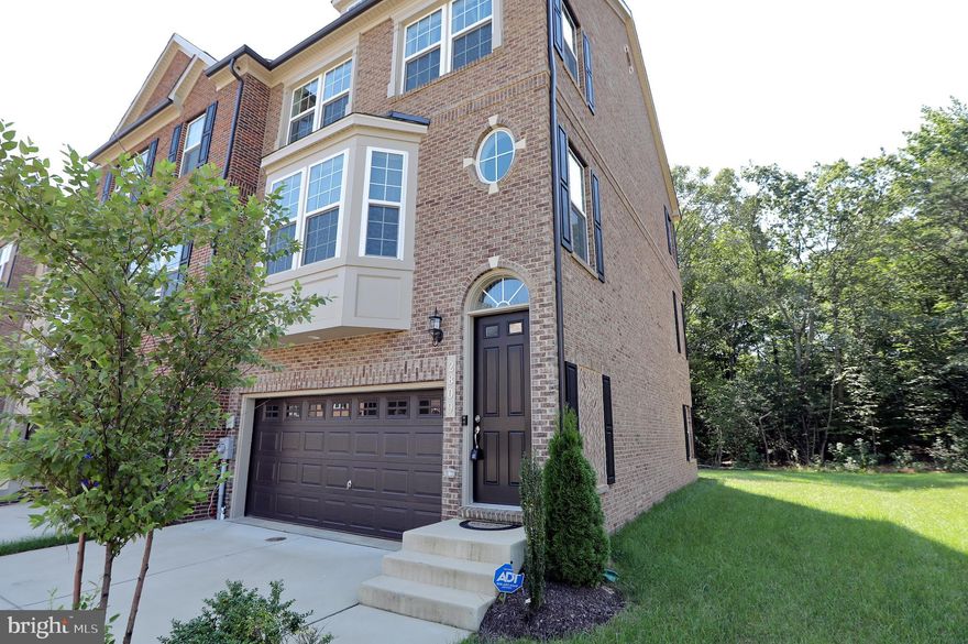 WHY WAIT FOR NEW CONSTRUCTION? This Gorgeous Stanley Martin townhome in the sought after Waldorf location is practically brand new! This 2280 sqft of elegant living space on 3 levels sits on a Premium Corner Lot that backs to the Woods. The main level features hardwood floors, a powder room, a living room with Bay windows, a Eat-In Gourmet Kitchen with a Massive Center Island, Stainless Steel/ Energy-Efficient Appliances, and Quartz Countertops. Your evening retreat to the elegant and serene master bedroom with walk-in closets and a full bath with dual vanity sinks. Additionally, on the upper floor are two well-sized bedrooms and a hall bath. If you need extra entertainment space, there is a den with a walkout basement.  Be sure to bring your pickiest buyer!