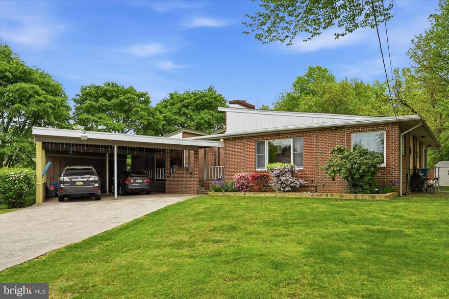 Welcome to 393 Monticello Ave—a spacious brick ranch-style home tucked away on a quiet cul-de-sac, offering over 2,200 square feet of living space on a generous half-acre lot in the Chichester School District. This property presents a wonderful opportunity to create your ideal home while enjoying a setting that already delivers privacy, space, and flexibility.

The inviting foyer features durable tile flooring, warm wood accents, and exposed beams that add architectural charm. From there, step into the living room, where a brick wood-burning fireplace serves as a striking focal point. Vaulted ceilings with exposed beams enhance the sense of space, creating an open and comfortable environment for everyday living.

The eat-in kitchen offers a highly functional layout with abundant cabinet storage and generous granite counter space, making meal prep and everyday living convenient. Classic cabinetry is complemented by a tile backsplash and built-in appliances, while the efficient design provides excellent workflow throughout the space.

Just off the kitchen, the den offers a comfortable living space with warm wood paneling that creates an inviting atmosphere. Its open connection to the kitchen adds versatility, making it ideal for a family room, TV area, or casual gathering space. From there, step into the enclosed porch, accessible from the den—a fantastic area for relaxing, reading, or enjoying your morning coffee.

The home offers a primary suite with its own private bathroom, along with two additional bedrooms that provide ample space for family or guests. Off the main living areas, you’ll find two smaller bonus rooms—well-suited for a private office, hobby space, or convenient storage.

Downstairs, the full basement is ready for your own vision —ideal for a workshop, additional living space, or storage.

A covered carport accommodates 2–3 vehicles, adding everyday convenience. The spacious yard provides plenty of room for outdoor enjoyment or gardening. The in-ground pool is operational but will require some TLC from the new owners.

If you’re looking for space, layout flexibility, and the chance to add value in a desirable location, this is a home you won’t want to miss.