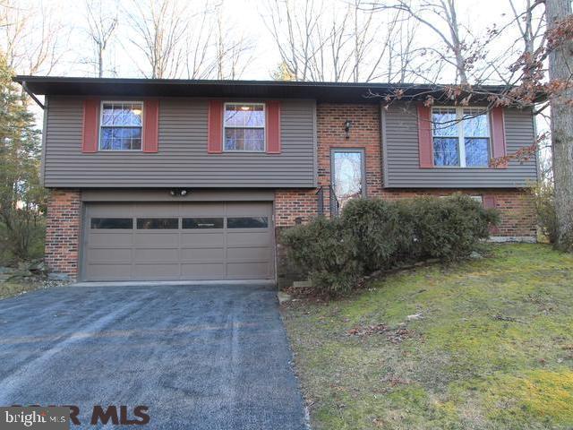 Updated beauty in desired Park Forest Village! This split-level home has been completely remodeled. From new electrical, plumbing, French doors onto deck, front storm door, vinyl tilt-in windows and siding to new Pergo flooring and full bath with tile shower in lower level and Brazilian tiger wood floors throughout the entire upper level, updated bath with Jacuzzi tub and rainforest shower head in full bath and updated kitchen with large tiered island, beautiful tile backsplash and much, much more! The entire house has been wired for sound, including the spacious back deck, making this a perfect home for entertaining. Move in ready and waiting for you!