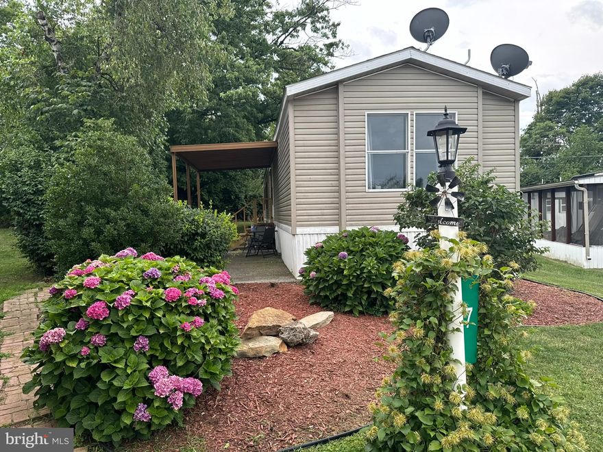 This is a very well maintained and updated 4 bedroom, 2 full bath home in Whispering Hollow MHP. Approx. 1064 square feet. If you want a modern looking home that is clean and well cared for, this is the one! Central A/C/heat pump system replaced about 3 years ago, newer water heater, updated flooring throughout most of the home and a wood burning fireplace are just some of the highlights. The home is situated on a spacious lot with a garden area, storage shed, and covered patio. Lot rent in Whispering Hollow is $610/month and includes trash. Water/sewer is billed monthly by the community. One dog per household is allowed with certain breed restrictions. Northampton School District. Total yearly taxes are about $988 with the Homestead Discount. Financing is available.