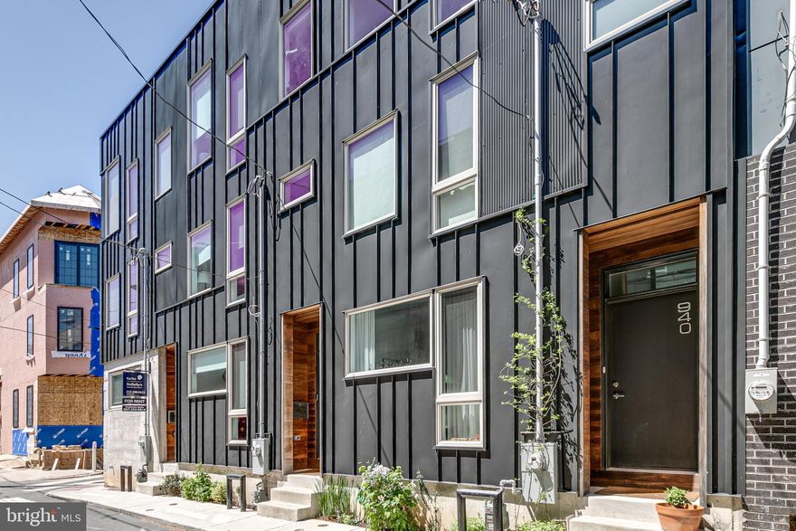 Welcome to one of the best blocks in Northern Liberties! This 3-years young home was built with quality craftsmanship by Callahan Ward and has just under 7 years left on the tax abatement.  Before you even enter the front door, enjoy a green garden space that you can make your own. Enter into this 16 foot wide home on the first floor, where you’ll find the open concept living room, dining room and kitchen, perfect for relaxing on the couch and entertaining friends and family. Equipped with a wine refrigerator, farm sink and Whirlpool appliances, the kitchen features Carrara marble island with waterfall on both ends as well quartz countertops. Don't miss the full pantry, large enough for pantry items and tons of storage. Through the sliding glass door you'll find space for your grill and a small herb garden. Up the stairs you'll find a full bathroom, including a tub and marble counter vanity. There are two bedrooms on this level, each with large windows for lots of natural light and large closets. Make a guest room, office, or even nursery with each of these rooms. Enjoy a deck to finish off this level, providing additional space for relaxing outdoors. Up to the third floor you will find the primary suite with high ceilings, lots of large windows and a full bath with Carrara marble floors and shower with rain shower head. The laundry is included on this level for ease of use. Walk up the stairs just outside the primary suite to reach your fabulous roof deck with 360 degree views including the city skyline as well as the Ben Franklin Bridge. Finally, the fully finished basement includes a coat closet, extra storage and full bathroom. Use this space as extra living area, play room, office or even bedroom. Owner is offering 3 months of private, prepaid parking in the small lot just before Saint John Neumann Way - extend for your use beyond that at just $225/mo. Enjoy neighborhood get togethers in a small, quiet pocket of Northern Liberties. Around the corner from Bardot, Cafe La Maude, Honey's and countless other restaurants, shops, and all that Northern Liberties has to offer, you'll be at home on Leithgow Street. Schedule your showing today!