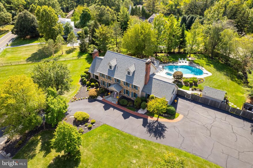 Wow just begins to describe this elegant retreat nestled on 1.4 acres  in the heart of Gwynedd Valley. This luxurious custom built home by Stevenson Builders has 5870 square feet, exuding sophistication and smart design. The grand entrance leads to an open-concept kitchen that seamlessly transitions into a family room, where soaring cathedral ceilings create an atmosphere of refined grandeur. Lovingly maintained,  this fantastic house offers five bedrooms and five and a half bathrooms, providing ample space for relaxation and privacy. The meticulously finished basement and versatile third floor add overtones of charm, featuring an additional bedroom and full bath on the top level. Four fireplaces are thoughtfully placed to provide warmth and a welcoming ambiance throughout. Step outside to discover a private oasis that is beautifully landscaped where a stunning flagstone patio encircles a resort style in-ground pool with a jacuzzi along with a separate cabana/pool house allowing for plenty of entertaining during the summer days. A whole house generator, comprehensive security system and a two car garage with an expansive driveway are additional highlights that make this house beyond desirable. Close proximity to public transportation, major highways and shopping and dining as well as being situated in the Highly rated Wissahickon School District. Schedule your tour today!