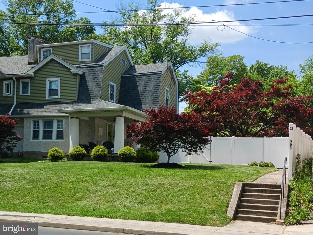Welcome to your Ambler Borough dream home! This beautifully renovated Dutch Colonial Revival blends modern upgrades with timeless charm—just a short stroll from Ambler’s vibrant downtown.
Step inside to find a bright, inviting layout. A sun-filled sunroom overlooking your private backyard flows seamlessly into the eat-in kitchen. Entertain with ease in the grand dining room and elegant living room, anchored by a Venetian plaster fireplace. A stylish foyer and convenient main-floor bath with a full-size laundry closet complete the first level.
Upstairs, you'll find three comfortable bedrooms and a spa-like bath with double vanity. Original artisan plasterwork, high ceilings, and hardwood floors highlight the home's authentic appeal. But wait, there's more! A finished third-floor bonus room, over and above the listed square footage, offers endless possibilities, while the super clean basement includes a second laundry area.
This large twin home feels like a single! The backyard is a tranquil retreat, featuring a naturalized pea gravel patio shaded by a mature flowering dogwood. A classic covered porch with iconic Dutch Colonial columns overlooks the extra-deep front yard. And the home's large private driveway (via Heckler Street) with ample parking is a rare borough find.
Major systems have all been replaced over the last several years—including new central air, gas heat, roof, 200-amp wiring, and plumbing—so you can move right in with peace of mind.
Investment minded? Home also offers the opportunity to separate into two units with independent access and parking on Butler Ave and from Heckler Street.
Ambler offers a true walkable community with restaurants, shops, entertainment, and a commuter train. Don’t miss the chance to own this delightful home in one of the most coveted locations in the region!