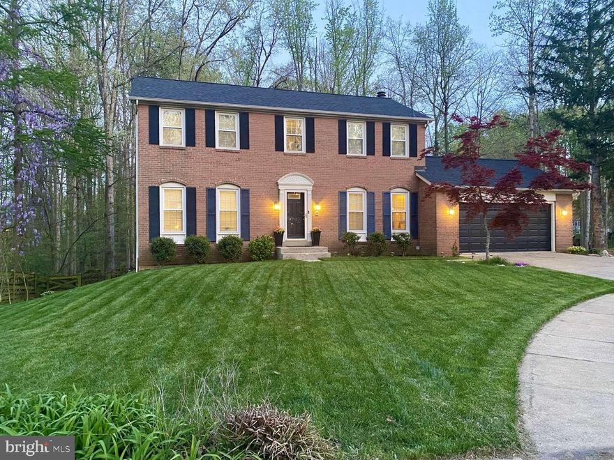 Welcome Home! Nestled in a friendly cul de sac in sought-after Cherry Run neighborhood, this 5 BR, 2.5+ BA home is just a short walk to Cherry Run Elementary. This lovely brick front colonial boasts a bright, spacious addition that opens off of the kitchen, a walk out basement with patio area outside, and a large deck with built-in seating that overlooks a generous, fully fenced yard that backs to wooded area. Kitchen has granite countertops, stainless steel appliances and a peninsula with counter seating area. Home has hardwood floors throughout the main level, new carpet upstairs, laminate floors in basement, and recessed lighting throughout. Primary BR has walk-in closet and en-suite bathroom. 2 car garage has automatic door opener and insulated garage door plus extra parking area on an expanded driveway. Home has new roof (1.5 yrs.), thermal replacement windows, new HVAC system in 2018 and a 240V outlet in the garage to charge an EV/plug-in hybrid. Located within the popular Lake Braddock Secondary School district, home is within walking distance to beautiful Burke Lake Park and South Run Regional Park.