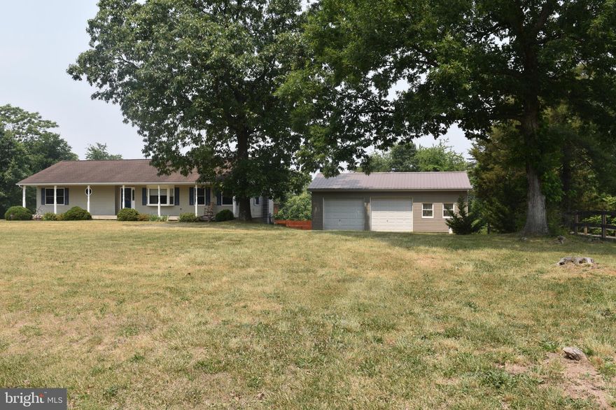 3-bedroom rancher on 3.5 acres, large open great room with fireplace, laundry room on the main floor, the basement is set up with a small apartment. There is a large detached 2 car garage with a shop area and an additional 2 car detached garage.