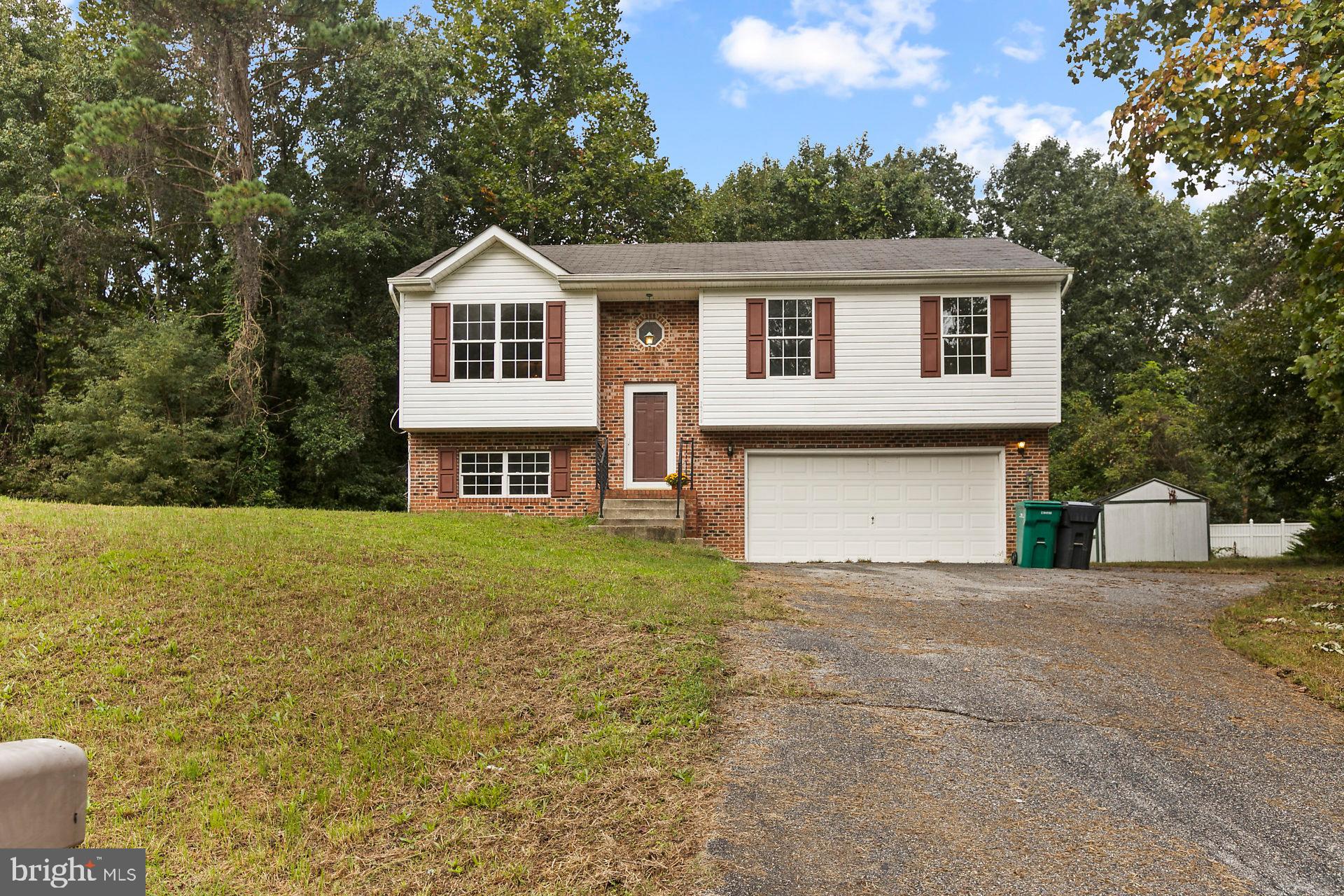 Perfect starter home in Hollywood on one acre private lot!! This home features 3 bedroom and 2 full baths with a cozy family room downstairs. New carpet and new paint make this home move-in ready! Home backs to woods and also features a deck for outdoor living! Schedule your tour today!