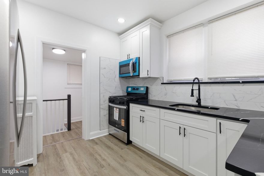 *** Open House this Saturday 3/14 from 12-2 pm.*** Step onto luxury vinyl plank floors that flow seamlessly throughout this recently updated, open-concept home! Fresh paint and a stylish accent wall with electric fireplace add modern charm. The kitchen features new cabinets, quartz countertops, and appliances (stove, refrigerator, microwave). Enjoy a fully rehabbed bathroom, finished basement with full bath, new bedroom rugs, and an updated electrical panel. Turnkey and ready to enjoy in a desirable location!