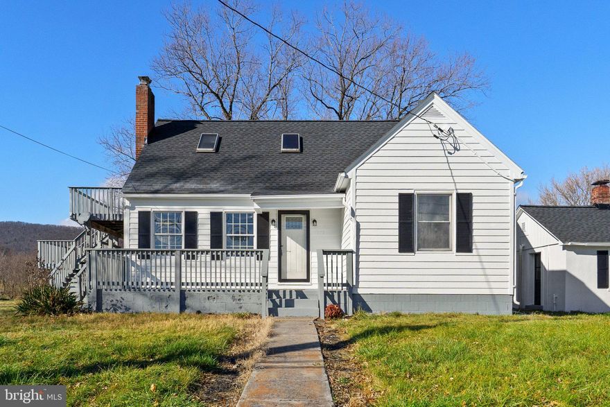 Two homes on 1.94 beautiful acres, with view of the mountains from the back porch! Upgrades include but are not limited to new flooring new roof new HVAC new Septic ect. All work permitted by licensed and insured contractors. Enjoy the deck off the master bedroom. Homes have two separate driveways with large home having a circular driveway. Buyer could fence the large area for animals or just enjoy the open space. Main house is about 1500 sq ft and cottage is about 650 sq ft. You won't want to miss this one!