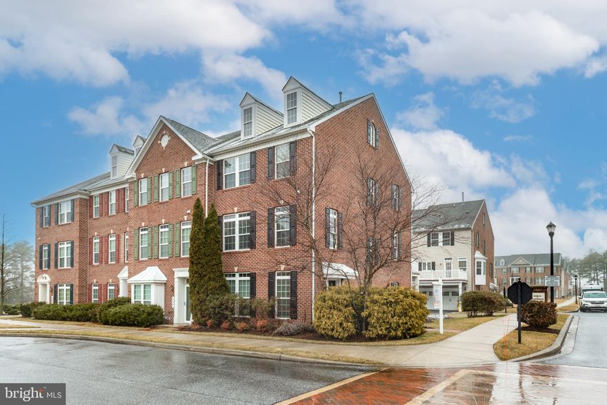 Discover the charm of this beautifully designed END-of-ROW townhouse in the desirable Residences at Buckingham! Move-in ready and available for quick settlement, this Colonial-style previous model home built in 2010 features a warm brick facade and offers a perfect blend of modern comfort and classic elegance. The entry level features a welcoming space along with access to the laundry and garage. Also off of the foyer you will find a dedicated office and half bath, the perfect work from home space! As you reach the main level, you will be welcomed to a warm and inviting atmosphere, thanks to the END-of-ROW units' extra sun-filled windows. This spacious open floor plan seamlessly connects the living area, dining area, gourmet eat-in-kitchen and half bath. The kitchen is a cooks delight, complete with upgraded countertops, a spacious island, and a pantry for all your culinary needs. You will notice well appointed choices of rich hardwood floors, crown moldings, and recessed lighting along with new carpet and fresh paint throughout. The generous primary suite includes a luxurious bath, custom walk-in closet and private primary loft with wet bar, perfect for a cozy relaxing in-home getaway. Also on the upper level are 2 well sized bedrooms and a full bathroom. Outside, the corner lot features a charming side yard and a lovely deck, perfect for outdoor gatherings or quiet evenings. The attached garage and paved driveway offer plenty of parking space. This home is not just a place to live; it's a sanctuary where comfort meets style. Don't miss the opportunity to make it yours!