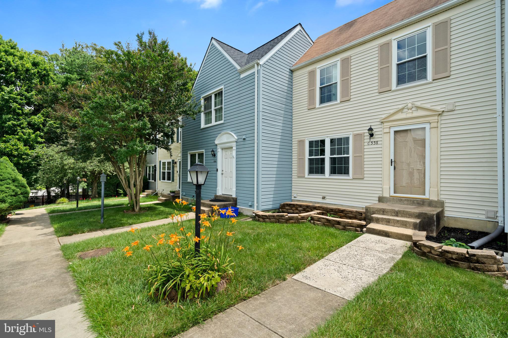 Welcome to this beautifully maintained townhouse in the highly sought-after Amberleigh community, offering a bright and open floor plan ideal for modern living. The main level features gleaming hardwood floors and a spacious kitchen with a cozy eat-in area that opens to a private deck—perfect for morning coffee or entertaining guests. Upstairs, you’ll find two oversized primary suites, each with its own en-suite bathroom and brand-new carpet. The finished lower level offers even more living space with a large rec room, a cozy fireplace, a wet bar, a third full bathroom, and a walkout to the fully fenced backyard. This level can easily be used as a bedroom/guest space. Freshly painted throughout, this home is move-in ready and waiting for its new owner. Enjoy fantastic community amenities including sports courts, playgrounds, and abundant green space. Conveniently located near shopping, dining, and entertainment at Kingstowne, Wegmans, and Springfield Town Center, with easy access to major commuter routes and the Metro via a lighted pedestrian path.
