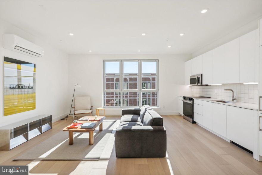 Welcome to 2406 Frankford Avenue, a stunning new construction building meticulously designed and developed by Archive Development. Pictures are of a different unit in the building but have the same finishes!

As you enter into the unit, you are welcomed by an abundance of natural light boasting from the massive factory-style windows. As you walk through the entryway and down the hall, you'll find the modern bathroom with white subway tile throughout the shower/tub combo, black delta finishes, and a floating vanity allowing for extra storage. The high ceilings throughout the living space continue into the bedroom which offers a large closet for storage, and ample space to comfortably fit a queen sized bed! The spacious, open concept kitchen and living area offers plenty of room for a sectional and/or dining table right by the enormous windows overlooking Frankford Ave. The European style kitchen is equipped with quartz countertops and panelized appliances. Full- sized washer and dryer in-unit for your convenience! Conveniently located to near all that Fishtown has to offer including Vessel Coffee Collective, Fiore, Martha, Philadelphia Brewing Company, Post Haste, Forin, and the brand new Picnic. Come see what Fishtown and 206 Frankford have to offer you! Pet friendly! Tenant pays electric and water. Please note photos are of a similar unit, floor plans vary but finishes are all the same.