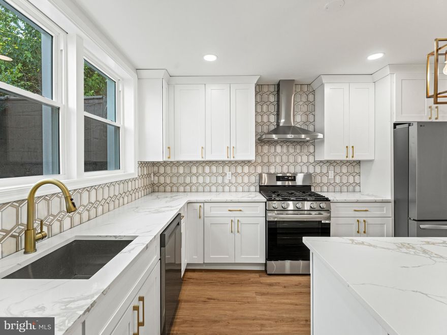 This South Philly stunner truly has it all! Fully renovated from top to bottom, this end-row home sits on an oversized 18-foot-wide lot—a rare find in the city. Offering 4 bedrooms, 3.5 bathrooms, and high-end finishes throughout, this property is the perfect blend of style, space, and convenience. Step inside to an open-concept living and dining area accented by beautiful chandeliers, flowing into a custom chef’s kitchen with a large eat-in island, stainless steel appliances, gas cooking, and a walk-in pantry. The fully finished basement provides additional living space and a private 4th bedroom with a full bath—ideal for guests, a home office, or a workout space. Upstairs, spacious bedrooms and modern bathrooms complete the home, with every detail thoughtfully designed. Enjoy year-round comfort with brand new HVAC, plumbing, and electric systems, and relax or entertain outdoors on your private back patio. Located just steps from public transit, and South Philadelphia’s best restaurants, cafes, and shops, this move-in ready home is one you won’t want to miss.