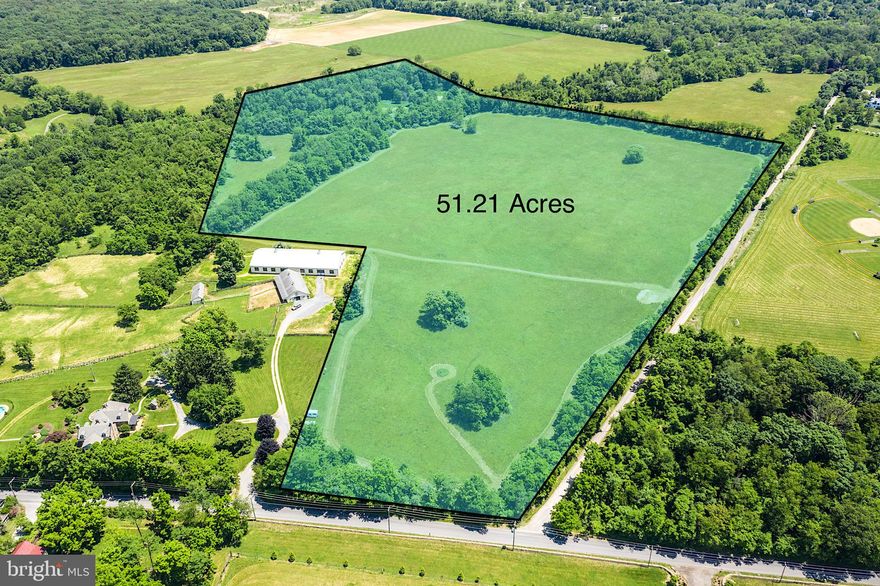 MOST INCREDIBLE LOT! Incredible opportunity to purchase this MAJESTIC 51 ACRE PREMIUM LOT with open land, partial woods and GORGEOUS PASTORAL AND MOUNTAIN VIEWS! If you are looking for PEACE and PRIVACY, this is the perfect lot to BUILD YOUR CUSTOM HOME and to BRING YOUR HORSES! You will be surrounded by natural beauty and abundant wildlife including deer jumping through the fields and wild turkeys! *** Located near Route 7 and at the corner of Woodgrove Road and Bell Road and directly across from the beautiful WILLIAMS GAP VINEYARD! The property is ABSOLUTELY BEAUTIFUL with GENTLY ROLLING HILLS and sited adjacent to the historic Woodgrove house! This parcel (LOT 2) is one of 8 parcels that once  belonged to the Woodgrove plantation. Two of the eight lots have been built on with custom homes and a barn. The lot 2 property survey plat shows three possible house location sites and two APPROVED DRAINFIELD LOCATIONS (6 Bed perc). Bell Road is a state maintained gravel road. The property is surrounded by beautiful stone retaining walls which enriches the land with a feeling of history and elegance. There is a deeded horse trail. Property is in land use, the seller is not responsible for any roll back taxes. The property is subject to an open space easement and is Zoned PD-H3. AMAZING LOCATION MINUTES TO ROUTE 7 AND NEARBY THE QUAINT TOWNS OF ROUND HILL & PURCELLVILLE. This property offers the best of Loudoun County living and is surrounded by many breweries and wineries! SELLER PREFERS COMMUNITY TITLE.