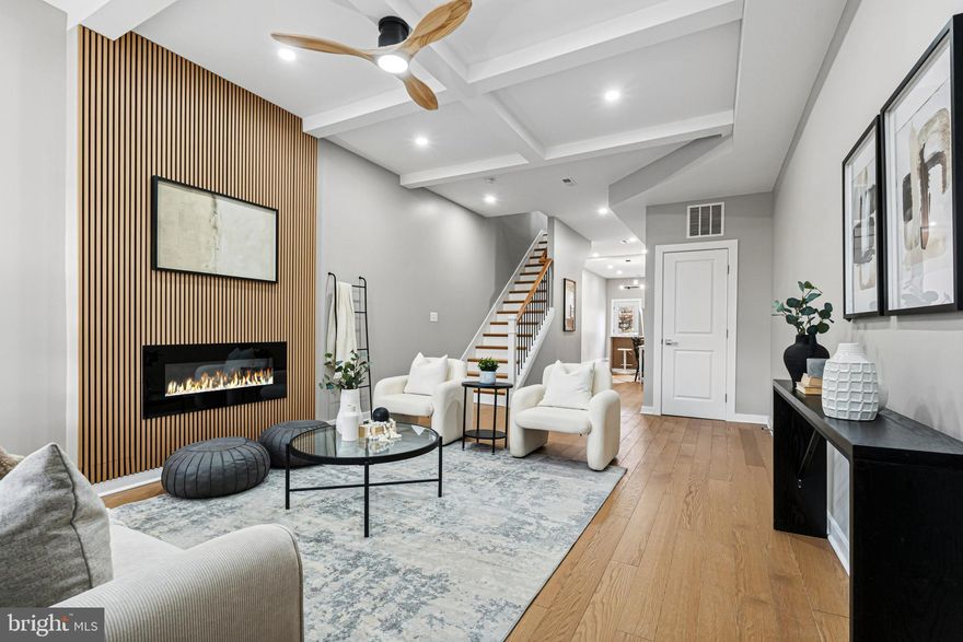 Imagine coming home to a space that feels intentional, modern, and completely yours. 2906 Clifton Ave offers that feeling from the moment you step inside. Thoughtfully renovated by APG Design Build, this home blends contemporary style with the warmth and character of Baltimore rowhouse living.

The sun-filled main level invites you in with its open flow and designer kitchen — quartz countertops, a waterfall peninsula, brushed black nickel hardware, stainless steel appliances, and a striking herringbone backsplash that makes everyday moments feel elevated. Step through the kitchen onto your private deck, perfect for morning coffee, summer dinners, or unwinding after a long day while overlooking your fully fenced backyard, an ideal space for gardening, play, pets, or hosting friends.

Upstairs, the spacious bedrooms and beautifully finished bathrooms feel like a retreat — calm, polished, and designed for real life. The fully finished basement, with its rear walk-out, adds flexible living space that can become a cozy family room, home office, creative studio, or guest suite.

Completely renovated with permits by APG Design Build — including updated HVAC, electrical, and plumbing — this home offers both style and peace of mind. Located in a neighborhood seeing continued revitalization, you’ll be close to parks, transit, and major commuter routes while still enjoying a quiet residential feel.

This home may qualify for multiple Baltimore City and Maryland down-payment assistance programs, including Vacants to Value (V2V), Live Near Your Work (LNYW), Baltimore City employee incentives, and Maryland Mortgage Program (MMP) options — making homeownership more attainable than you might expect.

Come experience it for yourself.