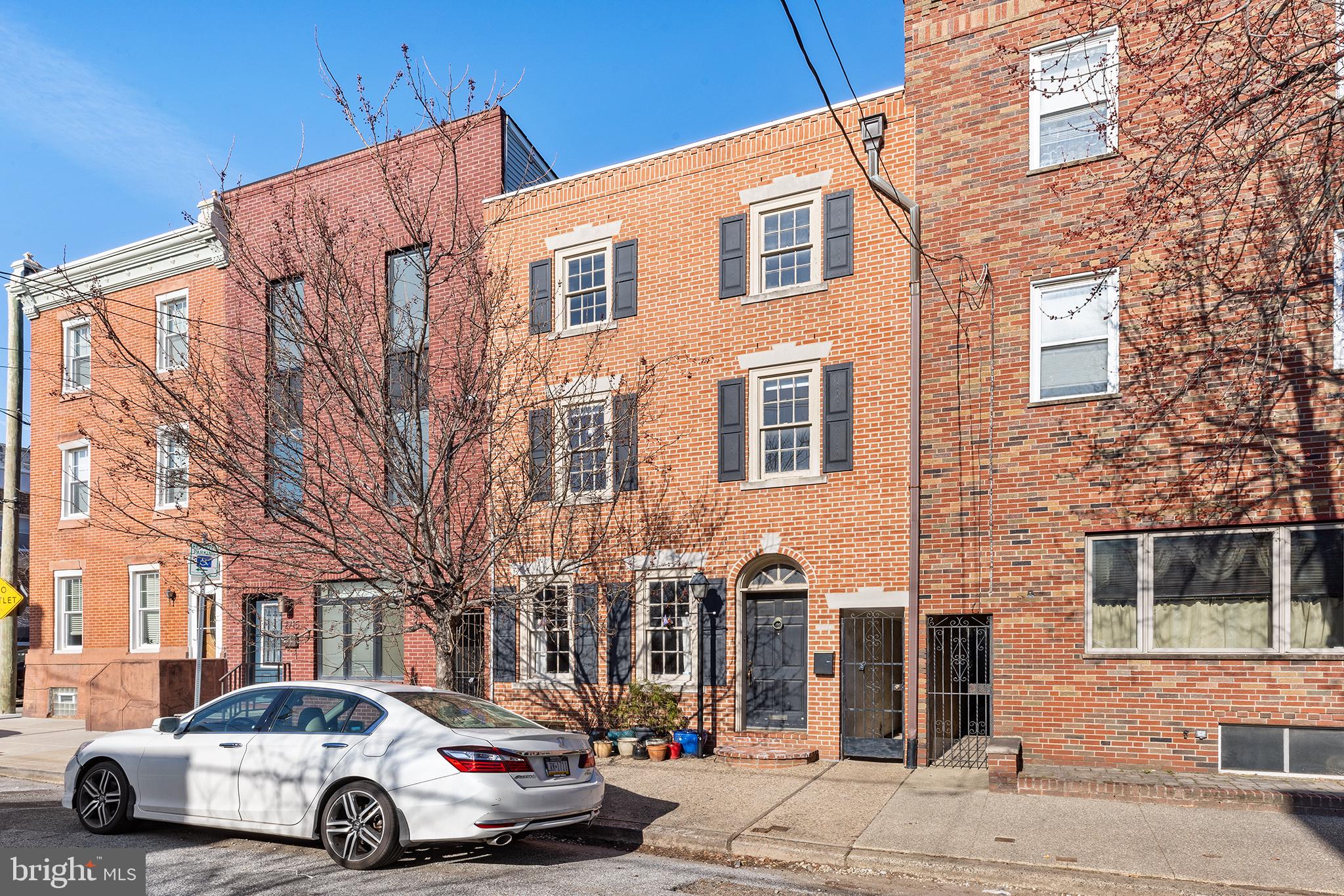 Welcome home to 2717 E Somerset St! This extra-wide home is ready to welcome its next owner. The classic Philadelphia facade with black shutters, an arched doorway, wooden windows, and a lamppost creates a charming first impression. A flowering tree adds beauty in the spring and shade in the summer. Inside, you'll find a light-filled living room with inlaid wood floors and exposed brick. The south-facing exposure and large windows create a warm and inviting space. The arched doorway leads to a spacious dining room, perfect for hosting gatherings. The updated kitchen and half bath feature handmade tiles, open oak shelving, semi-handmade cabinets, handspun oak drawer pulls, and a full-lite door that opens to the expansive yard. The two-tiered yard is ideal for both entertaining and gardening, with mature hydrangeas, a hibiscus tree, red twig bushes, and perennial flowers. Upstairs, the primary bedroom boasts two massive closets and two windows. A vintage pink full bathroom with original tile and tub completes the second floor. The third floor features stylish white wood floors and includes two rooms: one ideal for an office or nursery and another extra-large room suitable for various needs. Currently, it's used as a guest bedroom, office, and gym. This home seamlessly blends classic charm with modern updates. Located just a block from the 15 trolley, it offers easy access to both the vibrant Port Richmond scene (hello Tacconelli's, Nemi, Tin Car Bar, Carbon Copy x Mom Mom's, Reanimator, etc) as well as all that Fishtown has to offer. Don't miss your chance to see this wonderful home today!