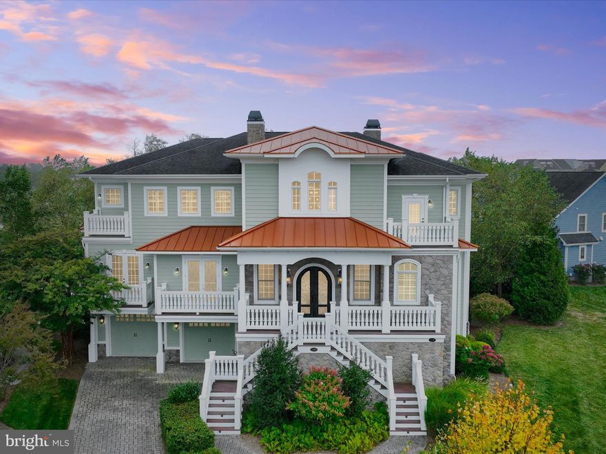 Introducing 24500 Kayakers Path, an exceptional Echelon custom home, thoughtfully positioned with two lots for space and privacy, in the sought-after community of The Peninsula on the Indian River. Combining coastal living with indoor and outdoor Mediterranean cues, a commanding exterior elevation rises up with a dramatic dual staircase articulated with robust balusters to welcome guests into a covered portico. Impressive entry doors with a sweeping arch atop are layered with iron and glass, setting the stage for what is to come inside. With interiors reminiscent of an Italian villa, a generous, two-story foyer is embellished with a deep coffered ceiling that is artfully crafted on a diagonal and is repeated in the pattern on the stone floor tile below. Arrival is celebrated in the piazza-styled entry foyer wrapped by a dramatic winding-stair; .and sided by a formal study clad in rich wood paneling, library built-ins, and a gas fireplace. With light streaming from a Palladian window, the extended foyer is flanked by a formal hall punctuated with engaged columns, mini-coffers and chandeliers that unfold as a foreshadow to the inspiring two-story great room beyond. Bathed in the light from a wall of stacked windows and atrium doors that frame panoramic views of the Lingo Creek and the Jack Nicklaus Signature golf course grounds, the great room boasts paired chandeliers and diagonal coffering on axis with a generous cast stone fireplace on one side, and a pair of strong architectural columns and arched opening inviting family and friends into an experiential, Italian cook’s kitchen like none other. A dramatic barrel-vaulted brick ceiling presides over an expansive contrast entertainer’s island, secondary-island, and professional appliances, luxuriantly finished in cabinetry panels and stainless steel. Spaces that radiate about the gourmet kitchen at the heart of the home include a waterside breakfast room with a stone fireplace and wood plank ceiling, a banquet-sized dining room with Venetian plaster over raised-rail and stile wainscoting, and a fully outfitted butler’s service pantry. This extraordinary floor plan together with architectural details and unifying elements are purposed to create spaces for grand-scale entertaining, while a private owner’s suite wing is outfitted with a cove-lit ceiling, fireplace, wet bar, sitting room, balcony and luxury bath that provide perfected main level living. The main level is completed by a finely finished elevator that services all three levels. Upstairs, there are four ensuite bedrooms, each with a private bath, walk-in closet, and balcony to enjoy magnificent views from sunrise to sunset. On the lower-level, high ceilings, full daylight, and an exceptional space plan invite additional living and entertaining with amenities at every turn. A second kitchen stands at the ready for large or catered gatherings and is located conveniently behind a central wet bar. Serve guests in the adjacent dining room toasting special moments before taking in a movie in the fully outfitted theater. The perfect completion to the thoughtful design of the lower level includes the library and music room, a nanny's office, a game room, and hobby room with abundant storage and organization options. Outside, a gas fire pit, and patio are surrounded by water views, seasonal blooms, and lush green grass that expands into an adjacent lot for more than generous outdoor living. Bring your dreams and come home to a very special lifestyle in a very special place on the Delmarva Peninsula where everyone of every age will enjoy bountiful adventures!