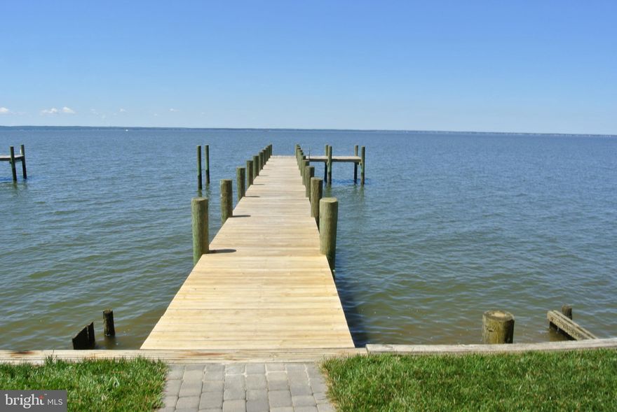 Relax on the Rear Deck and Enjoy the Panoramic Water view. Throw the Crab Pot in from your own Pier, Or jump on you Boat or Jet Skis. Whether this is your weekend home or your year round castle, you will quickly become acclimated to the "Island Life".  Golf carts permitted in this Island Community.  Short walk/ride to fantastic Waterfront Seafood Restaurants.  This immaculately maintained home boasts New Stainless Steel Appliances including a 36" Thermador Range, Bosch Dishwasher and High end GE Refrigerator.  Other amenities include a wood paneled elevator, massive First Floor Master, Second floor Sitting Room and second Master Suite, Sun-room,  Screened In Gazebo, Composite Deck, 100Ft - 4 year old Pier.  The AC unit was installed in 2019 and the roof was new in 2020.  The list goes on & on.  Just minutes from Swan Point Golf and Country Club.  Move In Ready.