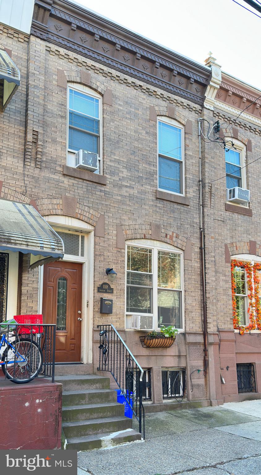 Whether you are a seasoned property owner or a first-time buyer, seize the opportunity to take a look at this charming brick-front duplex located in the heart of Lower Moyamensing. The first floor boasts a one-bedroom with a den/second bedroom, perfect for use as a home office. Meanwhile, the second floor features two bedrooms and one bathroom, currently occupied by tenants. Both units share an on-site basement storage and laundry area. The entire duplex features hardwood floors and large windows, which fill the main bedroom with natural light. The cozy open kitchen and living area offer ample counter space. Additionally, the first-floor unit has access to a small private rear yard, ideal for grilling during warmer months.