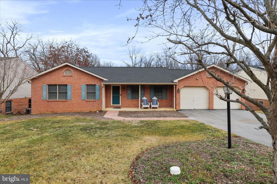 All brick rancher with an attached two car garage backing to woods located in Colonial Park! Main level features an open floor plan with cathedral ceilings in the living room and kitchen area with an eat-in dining space and a door to a beautiful deck to sit a relax, three bedrooms, two full baths and a laundry room. The basement has a family room, bedroom, office/rec room, a full bathroom, a utility and storage area and a walkout to a brick patio and fully fenced rear yard with two sheds (one with electric). Perfect location-close to interstates, the hospital and other medical offices, Hagerstown Community College, shopping, restaurants, and much more!  1 Year Home Warranty Included.