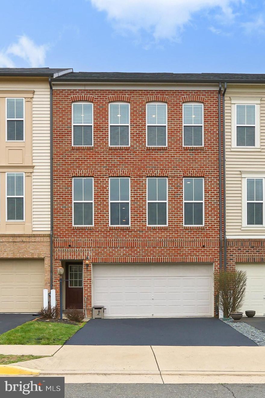 ** BEAUTIFUL & TURN-KEY READY ** You won't want to miss this upgraded, 3 BDRM, 2.5 BTH Miller & Smith townhome with almost 2,300 finished square feet in the highly sought after Victory Lakes community! Fresh, neutral paint & hardwood floors throughout provide a move-in ready atmosphere with no work needed. This open floorplan features a spacious, updated Kitchen to include an expanded island with breakfast bar seating, upgraded cabinets & Quartz countertops, farmhouse sink, tile backsplash & large buffet-style area that's perfect for entertaining.  The Kitchen opens to a Dining Area & Family Room with gas fireplace. Separate Living Room area that's perfect for a home office and/or play area or BOTH. Primary Bedroom features trey ceiling, two walk-in closets & updated Primary Bathroom with frameless shower. Two more additional bedrooms, hallway bathroom & laundry area (units will convey) round out the Upper Level. The Lower Level features a separate Guest BDRM / Rec Room with egress window & closet, as well as a 2nd half bathroom. Enjoy your fully fenced TURF backyard that backs to the common area for added privacy. Low HOA with amenities galore to include 3 pools, tot lots, walking trails, clubhouse, gym, tennis courts, dog park & so much more! Convenient location to restaurants, shops, movie theaters & golf courses. Easy access to major roads such as I-66, Routes 28 & 29, and only minutes from the VRE for plenty of commuting options!