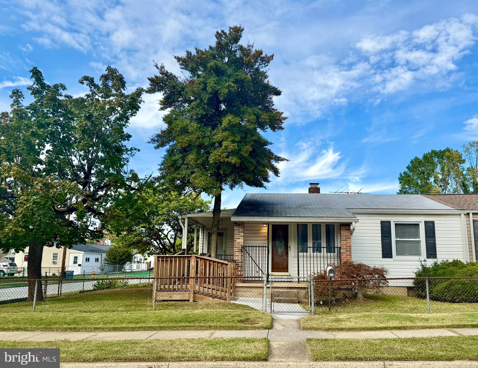 This Home has a Cozy Cottage Vibe. It has been well-kept. It features new windows and 2 covered porches. It is situated on a corner lot with a spacious yard completely fenced. It is one floor, easy living, and an eat-in kitchen as well. There is a Handicap ramp for easy access to the home. The basement offers plenty of storage. This home is within walking distance of a grocery store and public transportation.