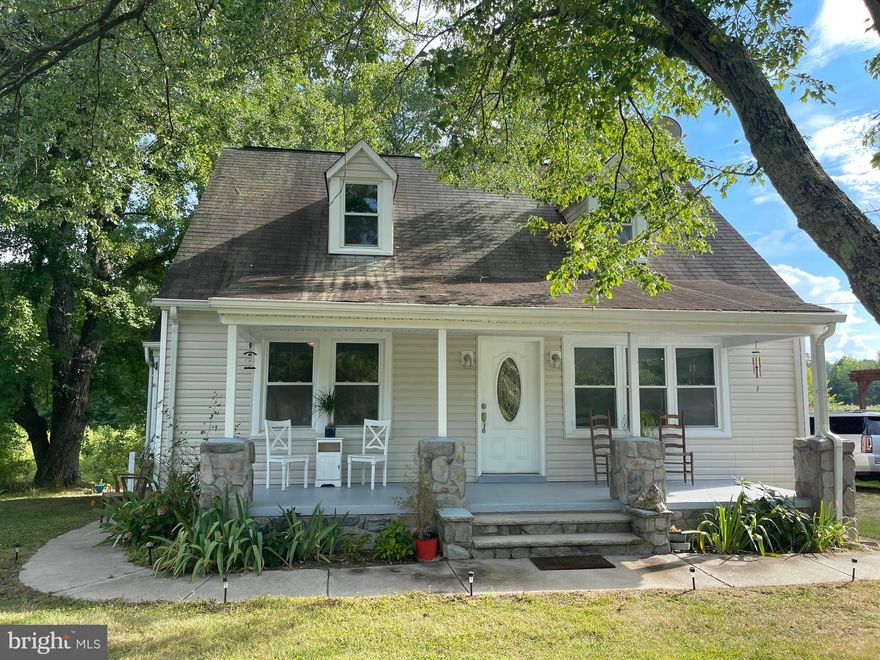 Adorable Cape Cod!! This home has 3BR and 1 BA.  The primary bedroom is located on the main level as well as the bathroom. New carpet on the first level. Sitting on a 1/2+ acre lot, along with its convenient location and ease to 95, can make this a great choice for a small family or commuter,  Extra storage in the basement is a huge plus and this is where the washer and dryer hook-ups are located. The beautiful front covered porch is perfect for front porch sittin' and enjoying the evening.  NO HOA adds to the charm of this little gem.  Schedule quickly...it won't last long!  Close to shopping, restaurants, I-95, Kings Dominion, the future Kalahari water park, Fredericksburg, Richmond.