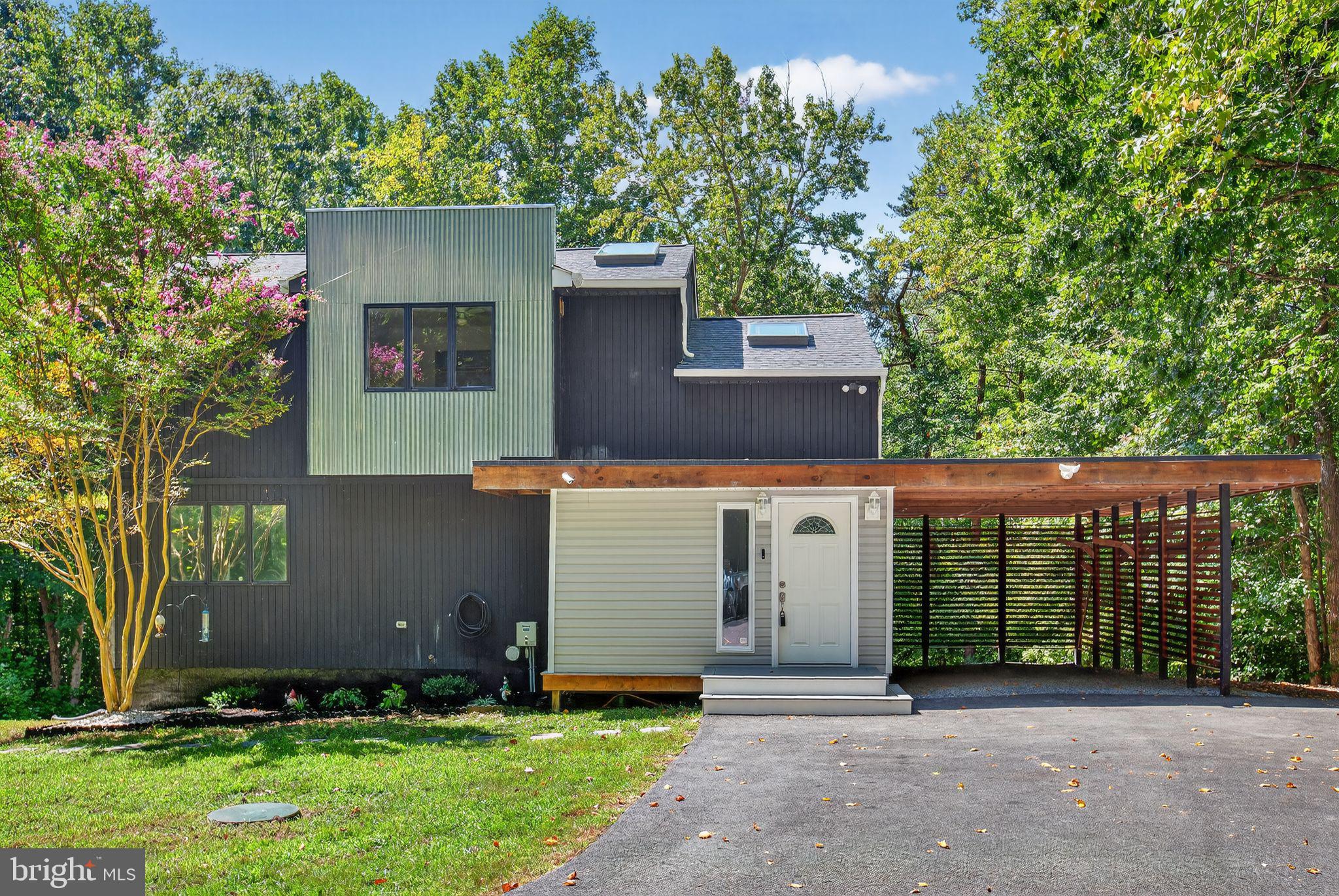 **Unique Contemporary Home on 5 Acres**
This beautiful contemporary home features 3 bedrooms and 3 full baths, situated on a stunning 5-acre wooded lot. Previously renovated on The Ellen Show, this home has gained notable recognition within the Chesapeake Beach community and Northern Calvert County.
This home is ideal for nature enthusiasts, hunters, or anyone seeking a peaceful retreat. There's even a treehouse (AS_IS - unknown condition) for the kids!
Key features include a new BAT septic system, a roof was replaced in 2022, beautifully refinished hardwood flooring throughout, and a new HVAC system, with the warranty transferring to the new owner at closing. All the big-ticket items are done!
On the main level, the eat-in kitchen boasts vaulted ceilings, updated Viking appliances, and elegant marble countertops. Gorgeous skylights provide ample natural light. The living room includes a propane fireplace with a built-in mantle and shelving. Sliding barn doors lead to the main level primary bedroom and the primary bath suite. The spacious Trex deck at the rear of the home offers plenty of space for cookouts or quiet evenings overlooking the gorgeous wooded lot, which features landscaping, rock, and pavers underneath.
The upper level comprises two additional bedrooms and a second full bath. The basement is awaiting your personal touches, featuring a third full bath, a utility sink, a recreation room, and an extra room that can serve as a fourth bedroom. It also includes a rough-in for a wood-burning stove.
Additional amenities include covered parking, two storage sheds, and a paved driveway.
Home is conveniently located near local amenities, including the farmer's market, boardwalk, and excellent local restaurants, it also offers easy access to Joint Base Andrews, Patuxent River, and Washington, D.C.