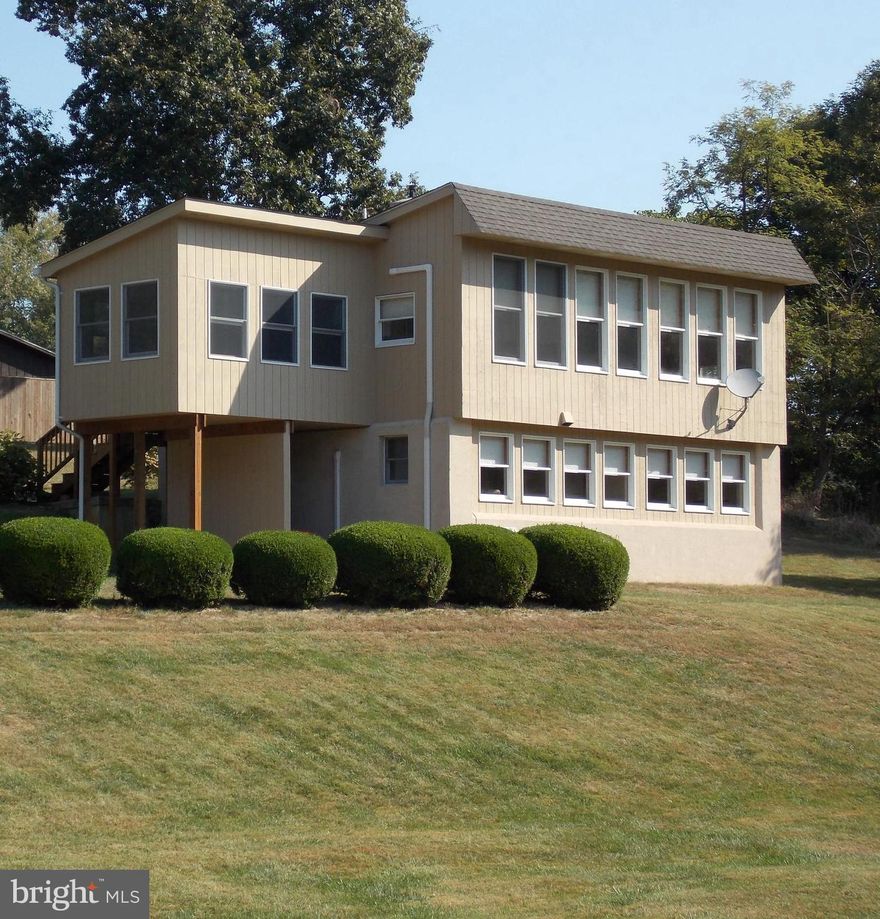 Unique open floorplan. Efficient layout with no wasted space. Passive Solar design floods the home with natural light.  All living space has southern facing windows.  Very private quiet setting on 6.2 acres (3 acres wooded).  3 season room on west side of home ideal for a studio with fantastic natural light.  Historic Harpers Ferry less than 10 minutes away. Great property for a primary residence or a low maintenance second home.  Commuter trains 10 min. Great restaurants in Harpers Ferry and Shepherdstown WV.  Hiking Biking, Boating, C&O National Historic Park. Deeded access to beautiful Crystal Lake and the Potomac River.  Crystal lake is crystal clear with grottos (real).  Potomac River access just 4 minutes away.  Bring your Paddle Boards, Kayaks, & Canoes,  Great fishing too.  House has lined masonry flue set up for a pellet stove with heat distribution vents for circulation.