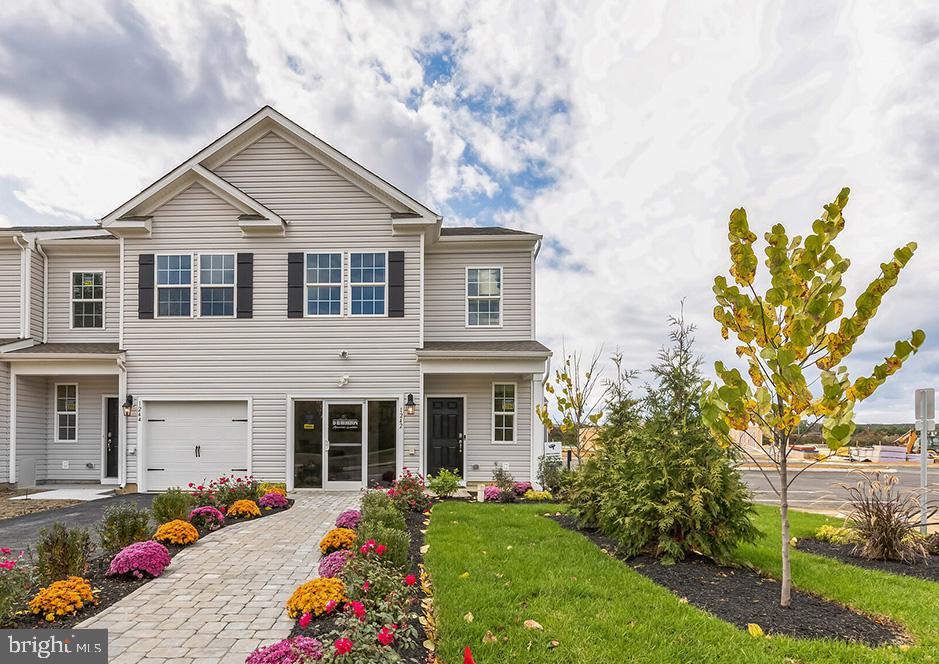 The Delmar  by D. R. Horton is one of the lowest priced new construction 2-story townhomes in Upper Macungie located in an inviting community with ample open space! This townhome features 1,500 square feet of open living space, 3 bedrooms, 2.5 bathrooms and a 1-car front-entry garage. This home is an interior unit. The main level eat-in kitchen with quartz countertops, upgradad cabinets, stainless steel appliances (including a refrigerator) and pantry opens to an airy, bright dining and living room. The second level features 3 bedrooms, all with generous closet space, a hall bath, upstairs laundry complete with a washer and dryer and a spacious owner's suite that highlights a walk-in closet and owner's bath with a double vanity and quartz countertops. The community also features wonderful amenity including playground, open space. Our location is truly unmatched with close proximity major highways and nearby cities such as Allentown, Lehigh Valley, and Bethlehem. Enjoy an abundance of shopping, restaurants, fitness and lifestyle activities, theater venues, farmers markets and much more! Local attractions include the beautiful Lehigh Valley Zoo, Crayola factory, Doney Park and many more!   All your everyday needs can be met by taking a quick drive to nearby Wegmans, Target, Giant supermarket and more. Parkland Crossing provides convenience at an affordable price! 

**Photos are representative and not the actual home.  Finish colors in this home may be different. **