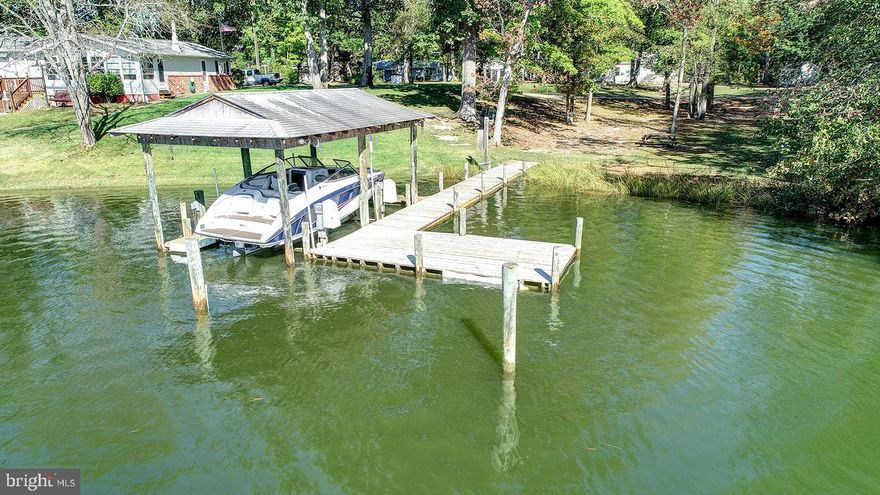 In search of the perfect weekend getaway? You ve found it on the Yeocomico River! This fully renovated 2 bedroom rancher is move-in-ready! The eat-in kitchen and indoor bathroom were completely gutted in 2008 along with a new heat pump & hot water heater was installed the same year. Store all of your toys and tools in the 30x40 pull-through garage and detached 10x14 storage shed, which was purchased in 2009 and BRING YOUR BOAT! This property comes with its own dock and covered boat lift! Just a short boat ride to the Potomac River! After a day of fun on the water, don t track dirt or sand into the house; wash off in the detached full bathroom, built in 2009, and throw your swim suits and beach towels right into the washer and keep the sand outside! Other updates include: new well & pump installed in 2007, all new plumbing in 2009, new roof installed on house in 2010 and a new automatic sprinkler system was installed in April 2015. You ll want to see this 1.04 acre waterfront property for yourself! This one will not last and call today to schedule your showing.