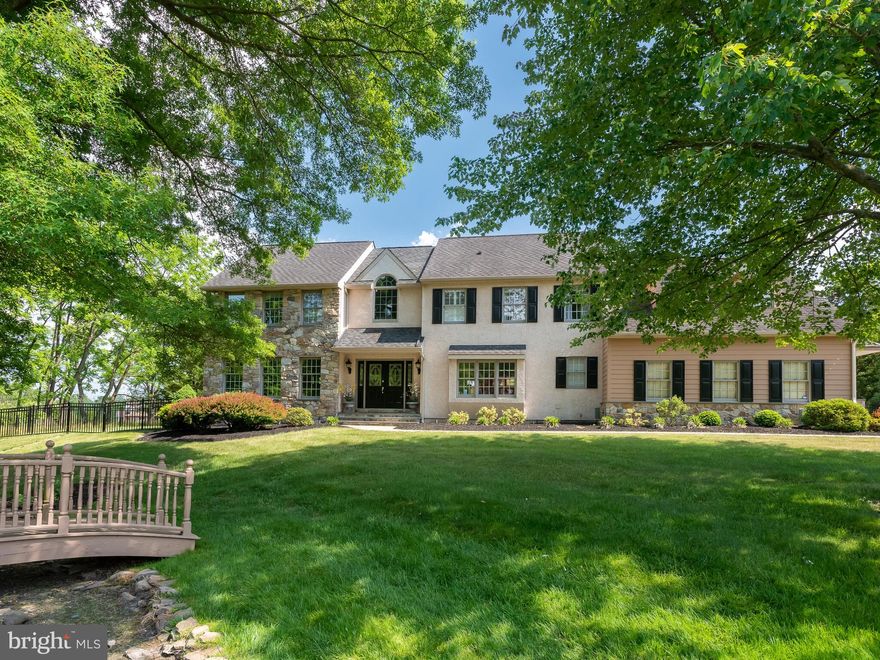 Looking for a turn-key home with all the amenities, on a private lot in a great area?  Welcome to 138 Barton Drive in Spring City. This open concept traditional home has been meticulously maintained and thoughtfully updated by its original owners so all you need to do is unpack and enjoy the park-like setting and back yard oasis! It features 4 bedrooms, 2.5 updated baths, over 4,000 SF of living space, including a spacious sunroom with fireplace, finished basement, expansive deck including a large enclosed porch, heated pool, hot tub, and professional landscaping.  Approaching up the flagstone walkway, you are captivated by the landscape and begin to understand this home is special.  The large 2 story foyer welcomes with a formal living room  and dining room on either side. The updated kitchen features a large dining area, white cabinetry, dark granite counters, an expansive island with seating for 3 and storage below.  And no shortage of storage with a custom  pantry.  There is even a large window over the sink to keep an eye on all that is happening outside!  Just off the kitchen, is a bumped out and thoughtfully designed laundry room.  Open to the kitchen is the large family room with its vaulted ceiling, new skylights with remote controlled shades, and fireplace.   Continue through the double French doors to the massive sunroom. This space was an addition to the original build and is flooded with natural light thanks to 3 walls of windows, one with access to the deck, and a second custom designed fireplace.  It’s the perfect place for morning coffee, or a glass of wine and quiet conversation.  A private home office with natural wood accents and French doors, and powder room complete this level.  Upstairs, the landing is open to the main level adding to the feeling of openness.  Entering the primary suite, you will appreciate the spaciousness and natural light.  The highlight is the updated primary bath featuring a designer claw-foot tub with high end hardware and its own crystal chandelier!  There is a glass enclosed shower, rich wood double vanity, large window and a new skylight with remote controlled shade. Three additional bedrooms are on this level, plus a bonus room, accessible only through the walk-in closets in two of the bedrooms.  This makes a great playroom, homework area or a second home office!  A recently renovated hall bath services these bedrooms.  Additional storage is found in the floored attic.  Head down to the basement for movies, games, or a cold beverage at the bar.   There are two big rooms, which can host  a large, growing or multi-generational family, plus ample unfinished storage.  The back yard has it all – a recently updated heated pool with a waterfall, a large hot tub and deck with multiple seating areas either outside or in the comfort of a screened in area.  Enjoy the sunshine and a swim and then retreat to the hot tub or watch the kids from the comfort of the covered deck.  The lush yard is quiet and private so you will feel like you are on vacation right at home!  This home has too many updates to list but highlights include recently updated HVAC (all 3 zones), roof, kitchen, all 3 bathrooms, new hardwood flooring throughout the main level, newer carpet upstairs, deck, pool, new paint in the living, dining, family rooms plus the office and hall. The home features a whole home generator and had a full home inspection prior to hitting the market, so you will have peace of mind for years to come.   It is set in a quiet neighborhood and is part of the award winning Owen J Roberts School District.  Access to routes 23, 100, 422 and 202 is easy.  You are under 20 minutes from Valley Forge or Marsh Creek Parks, 15 minutes to bustling Phoenixville or Pottstown and about 25 minutes to Malvern, King of Prussia or West Chester.  Center City and the airport are under an hour.  Come experience the amenities, updates, peace of mind and fabulous outdoor space this home has to offer. Welcome Home!