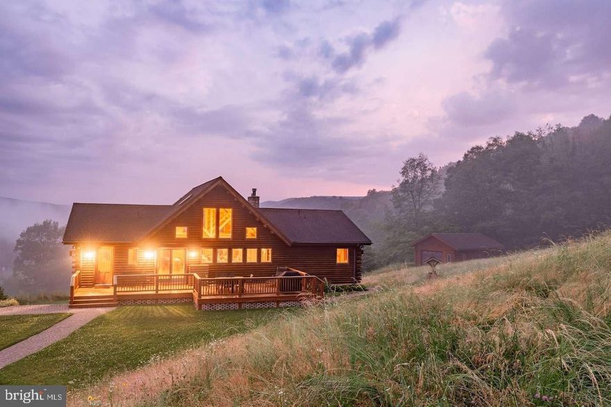 Private Mountain Retreat on 10.4 Acres Near Penn State – Fully Furnished with Proven STR Income
Welcome to 151 White Fawn Ln, an exceptional mountain retreat built in 2007 and set on a total of 10.4 acres, offering panoramic views, refined outdoor living, and proven short-term rental performance approximately 20 minutes from Penn State and Beaver Stadium. Privately situated within a scenic natural landscape and approached by a beautifully finished driveway, the property delivers an immediate sense of arrival and a true retreat atmosphere rarely found in today’s market.

Thoughtfully maintained and offered fully furnished, the cabin blends timeless mountain character with modern comfort, creating a space equally suited for personal enjoyment or continued investment use. Designed to accommodate larger groups, the home comfortably sleeps up to 16 guests and features spacious gathering areas, warm and inviting living spaces, and flexible accommodations ideal for families and group retreats. A dedicated game room enhances the entertainment experience, while a jacuzzi soaking tub provides an additional touch of relaxation. The overall condition and layout allow for a seamless transition to immediate use or continued rental operation.

Designed to take full advantage of its surroundings, the outdoor spaces are a defining feature of the property. Expansive mountain views, quality hardscape, and generous outdoor areas create a setting that feels both peaceful and elevated. A year-round hot tub enhances the retreat experience, and detached finished garage structures provide additional flexible space for recreation, storage, or future use.

Beyond its lifestyle appeal, the property has demonstrated strong financial performance, generating approximately $86,046 in annual gross rental income after OTA fees. Financial records are available for qualified buyers. Its proximity to Penn State supports consistent seasonal and event-driven demand while maintaining the privacy and tranquility expected from a true mountain escape.

Included within the total 10.4-acre offering is a separate 4-acre parcel that remains easily subdividable, adding rare long-term optionality for expansion, development, or resale. The combination of established income, scenic setting, additional acreage, and turnkey presentation creates a compelling opportunity that is difficult to replicate.

Whether envisioned as a private family retreat, a high-performing short-term rental, or a legacy mountain property to enjoy for years to come, 151 White Fawn Ln represents a rare opportunity where comfort, privacy, and investment potential come together in one exceptional setting.

Opportunities combining this level of privacy, acreage, proven income, and proximity to Penn State are rarely offered.