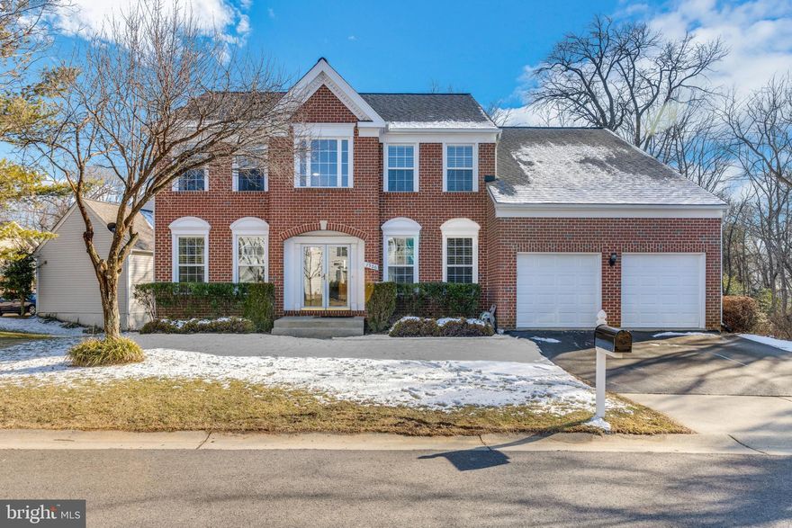 Welcome home to this beautiful brick front Colonial in Kings Point! You'll have plenty of room to grow in this 5 bedroom, 3.5 bath home with nearly 4,000 sq ft of space situated on .2 acres of land! Walk into a light and bright two story foyer with a convenient coat closet and wood floors that flow throughout the main level. To your right, open the French double doors to the perfect home office that features a 3 light chandelier and large windows. To the left of the entrance is the living room that features crown molding, 5 light chandelier and corner windows. Entertain easily in the formal dining room that features crown molding, wainscoting, oversized windows and a modern style chandler. The spacious kitchen with recessed lighting provides plenty of cabinet and counter space including a center island with gas stove and seating for 3-4 people at the breakfast bar! Also features a deep sink with detachable faucet and window view, and all stainless steel appliances including an additional wall oven and French door refrigerator with pull out freezer plus ice maker! Enjoy everyday meals in the neighboring breakfast nook and enjoy the view of the outdoors from the bay window plus glass door combo that leads to the gazebo like screened in deck with leaf motif ceiling fan - the perfect place for warm weather entertaining! Enjoy the fresh air with the open air portion of the deck - a great place for grilling! Take a break in the family room that looks out into the back yard and includes a cozy fireplace and corner windows. Half bath completes the level. Retreat to the large primary bedroom with vaulted ceilings, cooling ceilings fan, two walk in closets and a sitting/office area. The en-suite includes an extra long dual vanity, soaking tub and separate glass shower for an everyday spa like experience! Three bedrooms, all with plush carpeting and a hall bath complete the level. The walkout lower level is perfect for additional living space or rec room and features recessed lighting and wood-like floors. The 5th bedroom and 3rd bathroom in the basement is perfect for in-law suite or making extra income with an airbnb space! Double glass doors lead to the underdeck paved patio, and sliding glass doors take you to a private patio with relaxing hot tub (as-is) that looks out into your private wooded backyard. Enjoy the swinging bench as you sip your favorite hot beverage and look out onto the serene green view. You'll have plenty of parking in the 2 car garage and paved driveway. You'll love this quiet neighborhood and everything Kings Point has to offer like the multiple community centers, 6 pools, tennis courts, pickleball courts, along with recreation/ park areas and natural amphitheater! Conveniently located close to D.C. and Baltimore, with the technology corridor in between. You do not want to miss this one!