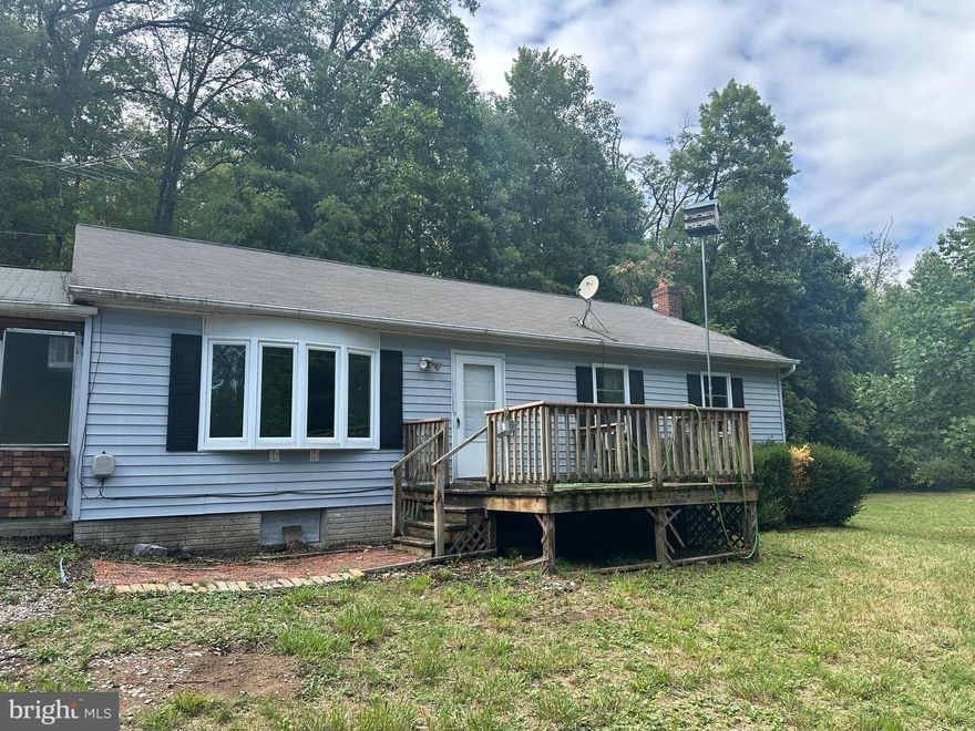 Have you been looking for a rancher in the country? If so, this might just be the one for you! Conveniently located in between Berkeley Springs and Hedgesville and right off of route 9. This house is a 3 bedroom with 2 full baths, large living room area and an eat in kitchen! The home also has a full finished basement with a nice bonus room for an office or man cave! The home needs some cosmetic work but it’s a great slate to start with and make it your own! Come check it out today! MULTIPLE OFFERS! HIGHEST AND BEST DUE BY 8/31/2024 AT 5PM