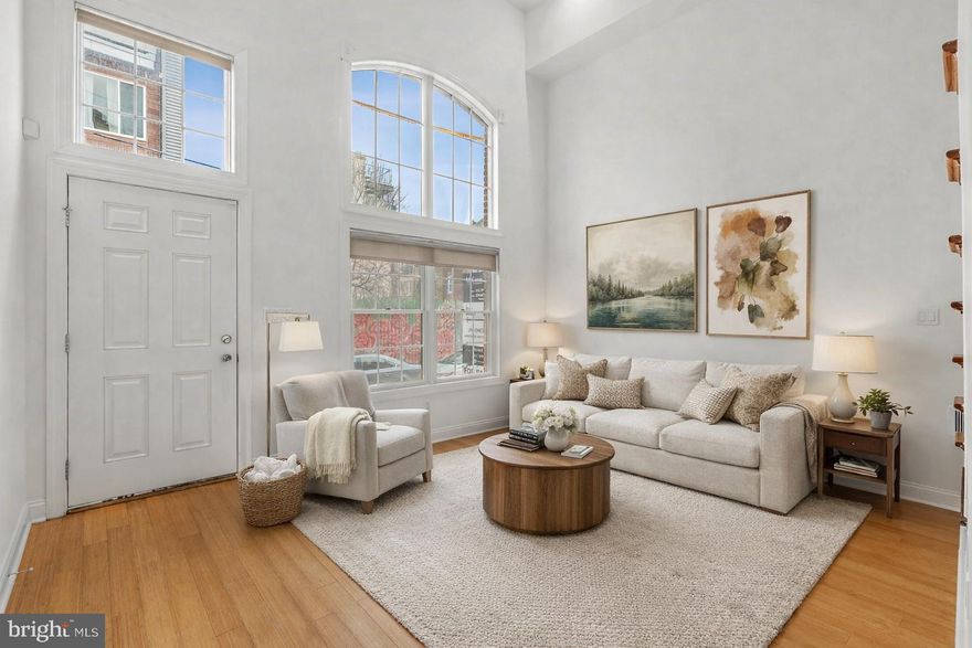 Welcome to this exceptional home in the sought-after Liberty Greene community in Northern Liberties, complete with coveted garage parking. This striking residence blends classic brick frontage with modern, sophisticated design. Step inside to a dramatic living room featuring soaring 14-foot ceilings and abundant natural light. A short flight of stairs leads to the dining area and kitchen, thoughtfully positioned to overlook the living space—offering both an open-concept feel and defined living areas. The kitchen provides access to a private balcony, perfect for grilling and entertaining. The second floor includes two generously sized bedrooms, a full hall bath, and convenient laundry. The entire third level is dedicated to an expansive owner’s suite with a spa-inspired bath, two oversized walk-in closets, and a private balcony showcasing sweeping city views. A fully finished basement adds flexible living space, and the unbeatable location places you just steps from Liberty Lands Park, Liberties Walk, and an array of popular cafes, restaurants, and neighborhood amenities. This is a rare opportunity to own a beautifully designed home in the heart of Northern Liberties. Taxes and square footage is the responsibility of the buyer to have verified independently. Ask us about other available for sale homes in the community.