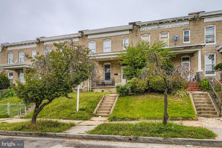 This beautifully updated Baltimore rowhome blends classic charm with modern style. Step through the inviting front porch into a bright, open floor plan featuring gleaming hardwood floors, fresh paint, and abundant natural light. The spacious living and dining areas flow seamlessly into a stylish, fully renovated kitchen complete with stainless steel appliances, quartz countertops, and ample cabinetry—perfect for everyday living or entertaining. Upstairs you’ll find generously sized bedrooms with roomy closets and an updated full bath. The finished lower level offers additional flexible space—ideal for a family room, home office, or guest suite—with a second full bath for convenience. Outside, enjoy a private fenced yard, a welcoming rear patio, and a shed for extra storage. Parking is easy with street access and a low-maintenance exterior. Located minutes from shopping, dining, and major commuter routes, this move-in ready home delivers comfort and convenience in a vibrant city neighborhood.