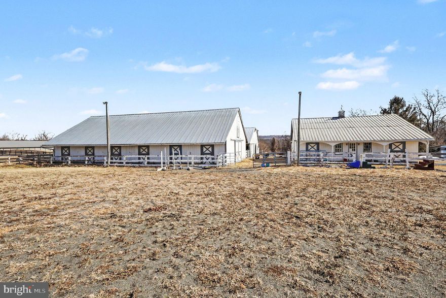 Welcome to 22244 Sam Fred Rd, Middleburg, VA. Please be advised that this is an Active Working Farm. For the safety of everyone visiting and the animals, we ask that all visitors to the farm be escorted onto the premises. All visits to the farm are by appointment and escort only. Please do not wander or let children roam freely. For the safety of the animals no glass products are allowed on the farm.  Please park on paved surfaces only, no parking on grass surfaces.

Nestled in the heart of scenic Middleburg, this exceptional 18-acre equestrian property presents a rare opportunity to own a fully operational horse farm in one of Virginia’s most sought-after countryside settings. Offering privacy, open space, and endless potential, this working farm blends comfortable residential living with equestrian amenities. Whether utilized as a Boarding Farm, or maintained as a private farm your family will not be disappointed. The property suits trainers, students, horse owners needing boarding, or those seeking to expand an existing program. For your horses' comfort, the farm includes three barns with a total of 30 horse stalls including five broodmare stalls, three tack rooms, two feed rooms, and a lighted riding ring. 

This ranch-styled home features approximately 3,326 square feet of living space on two levels.  Two separate entrances afford your the opportunity to sit and enjoy the front porch or ease of access to the farm area. Thoughtfully designed to accommodate both everyday living and entertaining, the 1st level features three bedrooms and two bathrooms, a well-appointed kitchen, and a breakfast area that leads out to a large deck. The walkout basement includes a spacious living room filled with natural light, a welcoming family room, a bathroom, and a multifunctional bonus room ideal for an in-law suite, a home office, studio, or guest space.  For your personal use a detached two-car garage and ample paved parking exist. 

The property is being sold strictly as-is, in its current condition. A detailed brochure is available upon request. This is a rare opportunity to acquire a turnkey equestrian facility in prestigious Middleburg — where country lifestyle meets equestrian excellence.