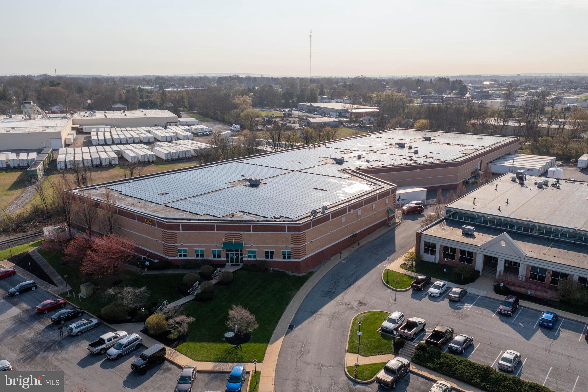 93,000 sq. ft building leased to long term single tenant through July 31, 2022 with 2- 3 year renewals and escalators/ 2- drive in doors/ 11 dock doors with levelers/ sprinklered and heated/ 24' ceilings with 20' clear height/ Office space heated and cooled/ In 2011 a new rubber roof, sheathing and insulation installed as well as 3024 solar modules on roof producing 922.32 kW/ Space is demised into approximately 35,000 and 57,000 sq ft units for future multiple tenants/ Diesel generator/ rail behind building/ This is unit #4 in the City Line Condominium.